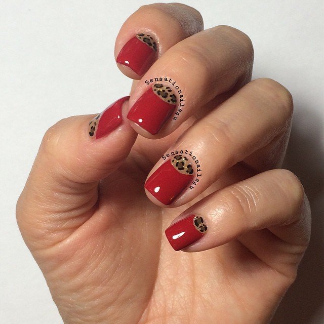 Red Half-Moon Nails with Leopard Print Cuticle Arcs