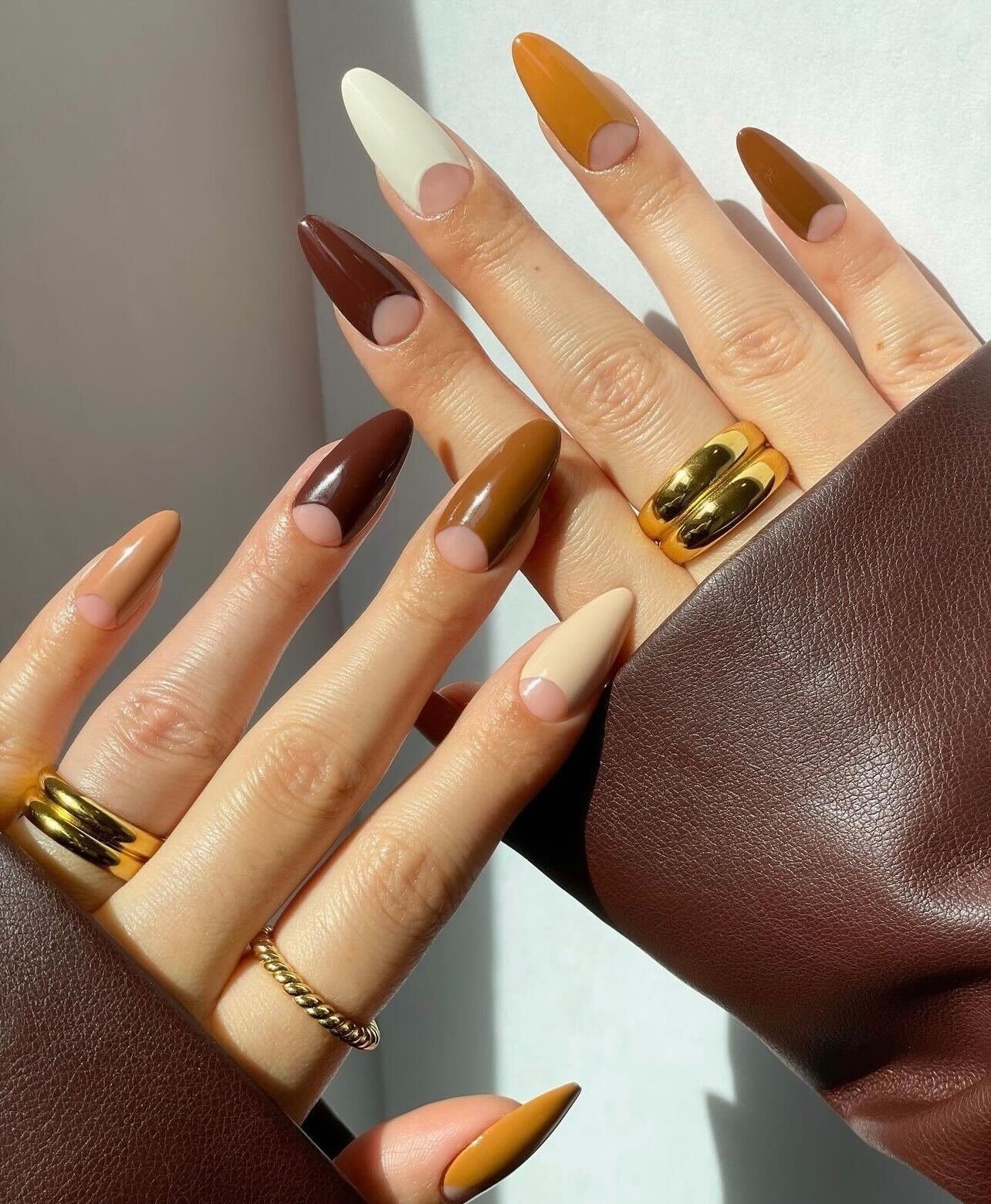Brown, Cream, and Orange Almond Nails with Half-Moon Color Blocking