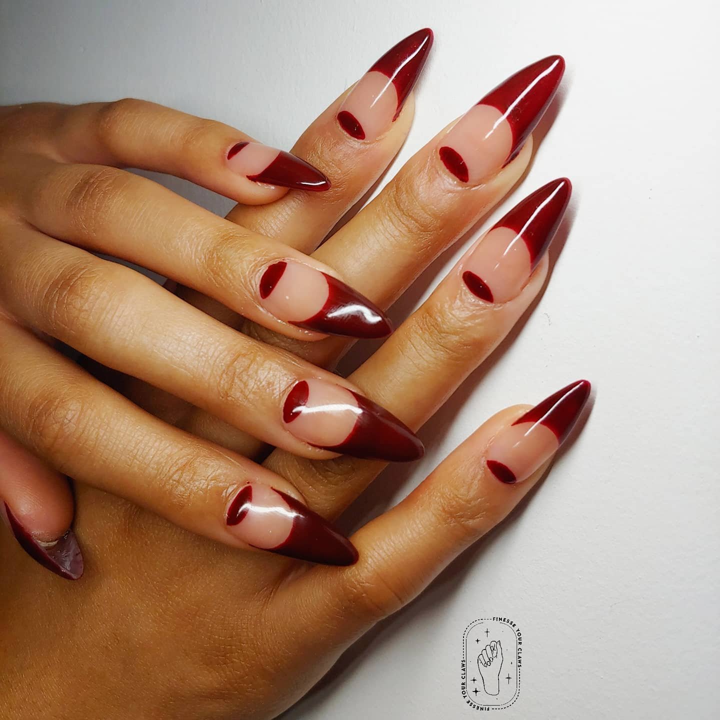 Deep Red Almond Nails with Nude Half-Moon Cutouts