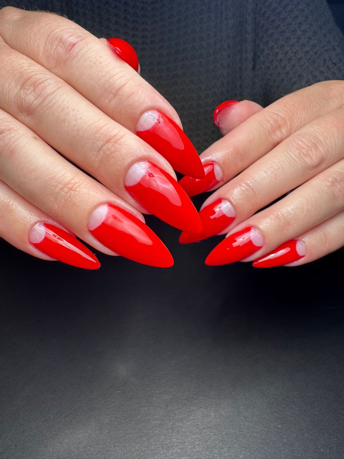 Vivid Red Stiletto Nails with Pale Pink Half-Moons