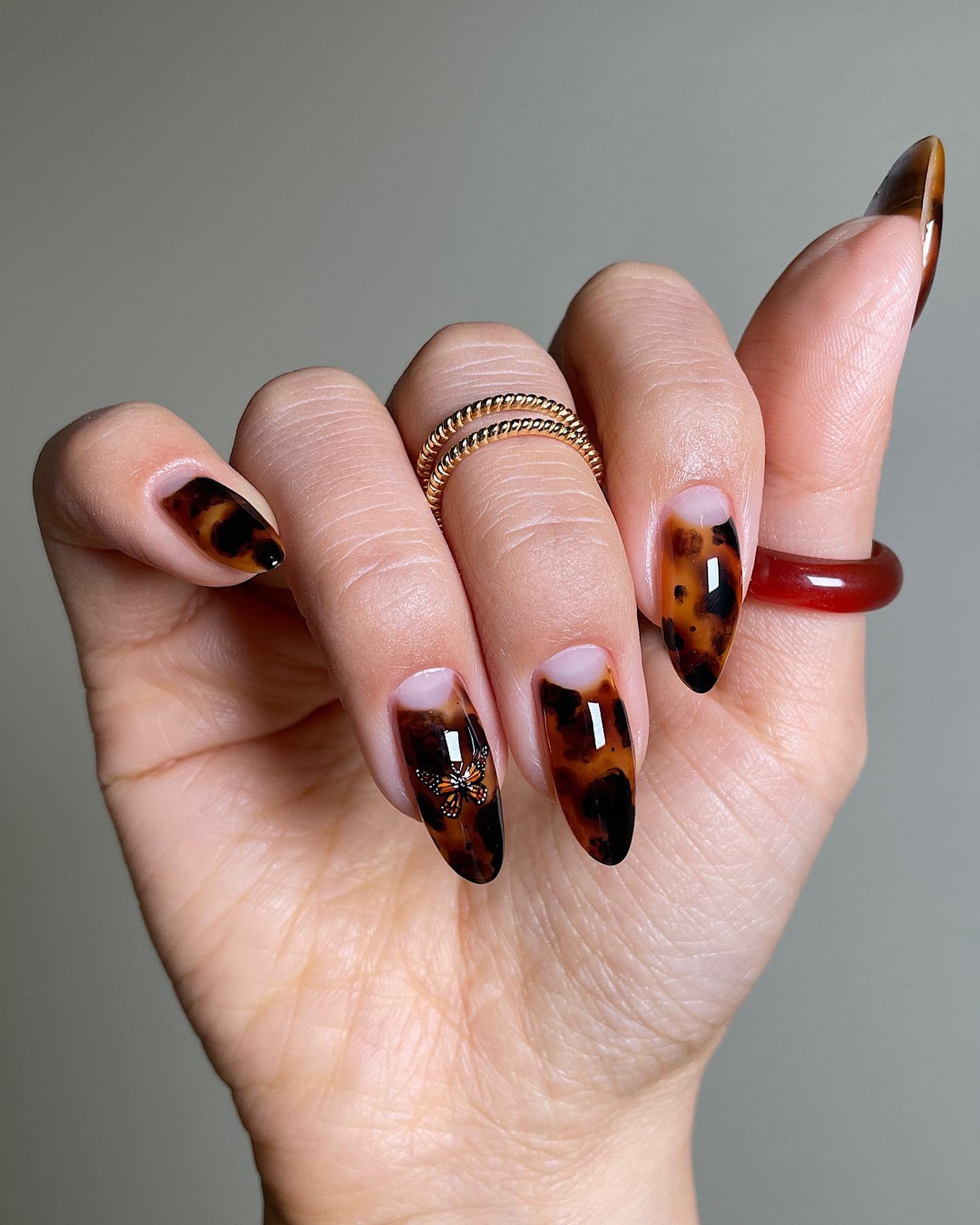 Brown Tortoiseshell Almond Nails with Nude Half-Moons