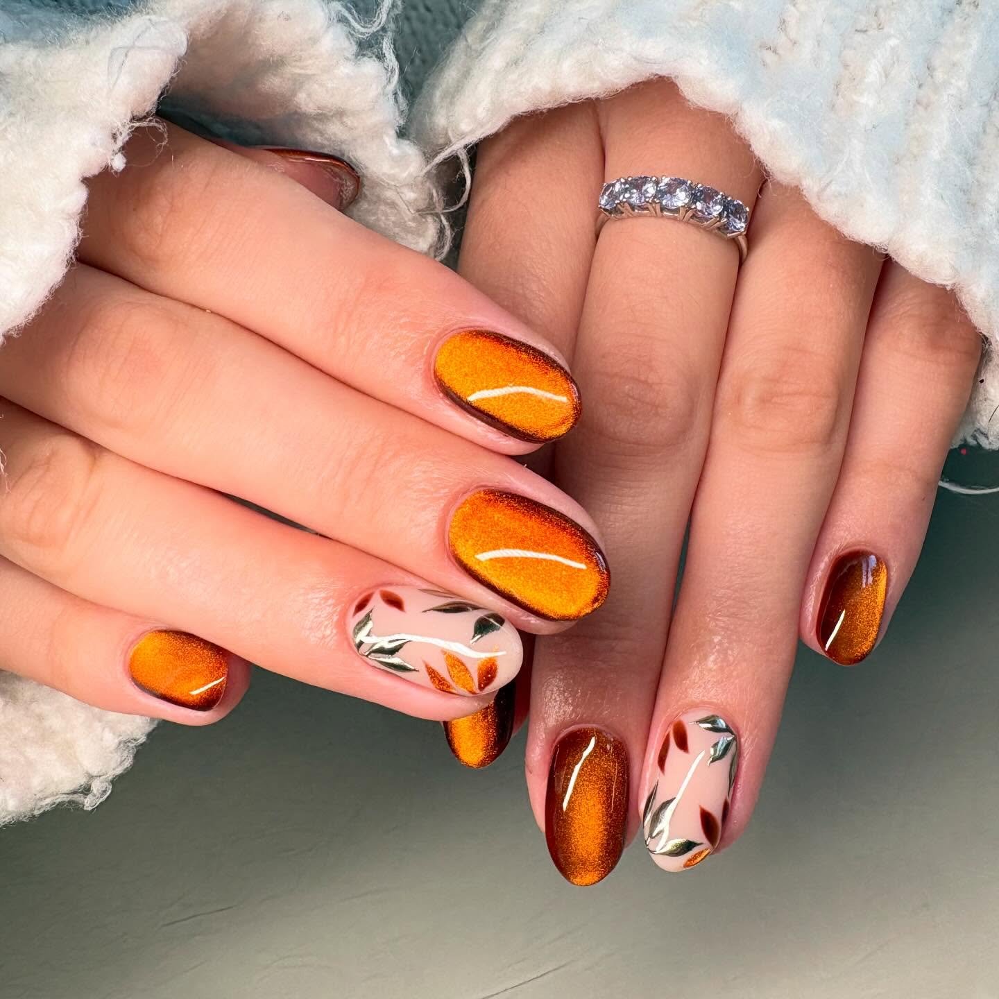 Orange Metallic Oval Nails with Abstract Accents