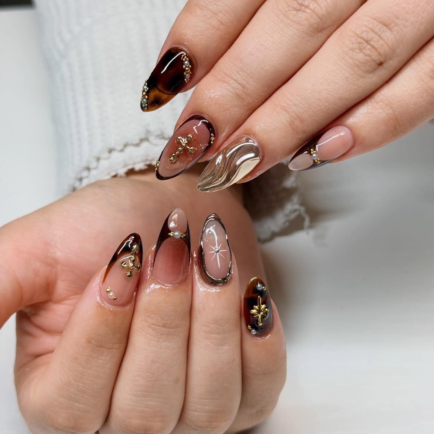 Brown Chrome Nails with Gold Leaf-Like Accents