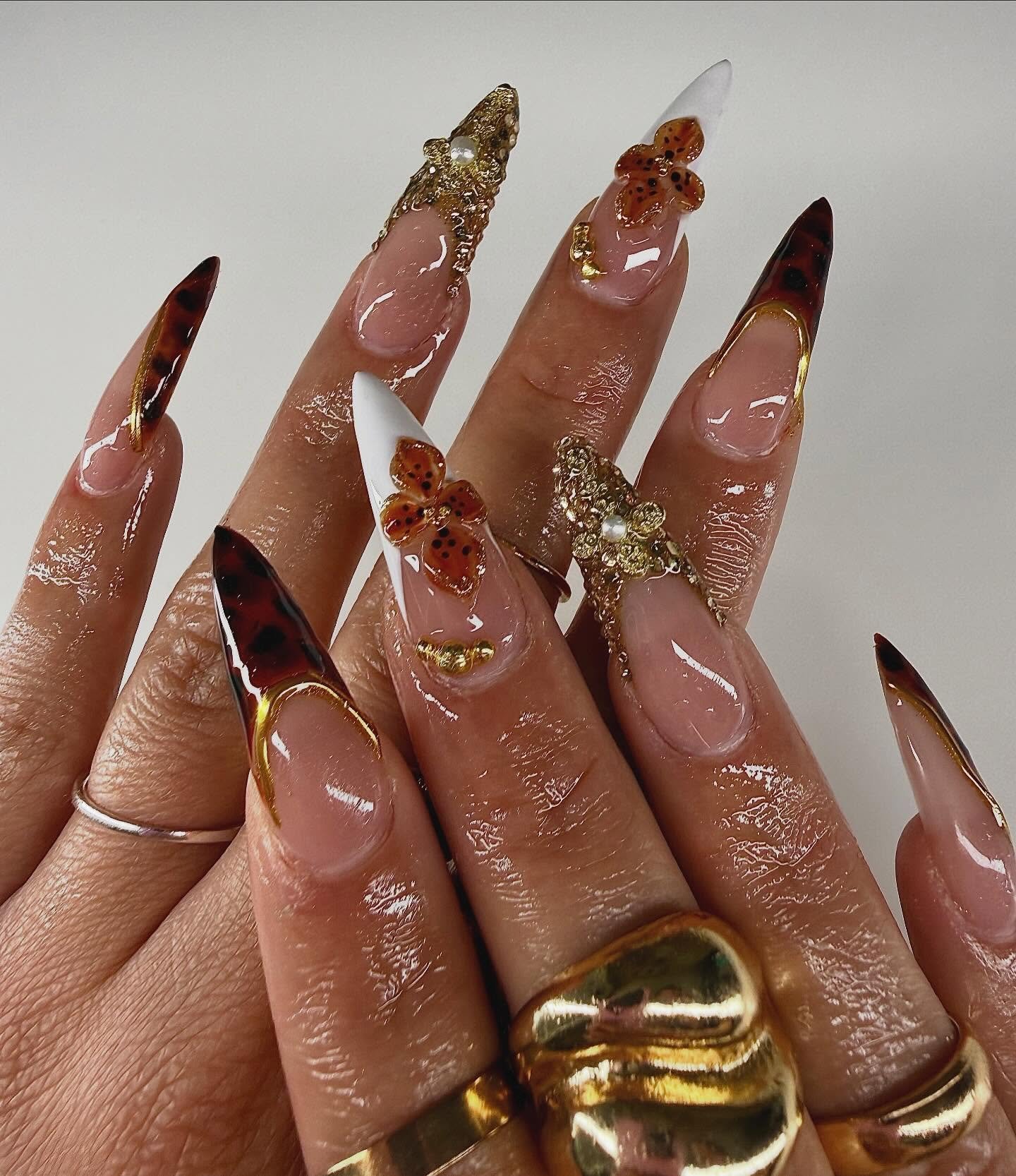 Long Pink and Brown Almond Nails with Leaf and Glitter Details