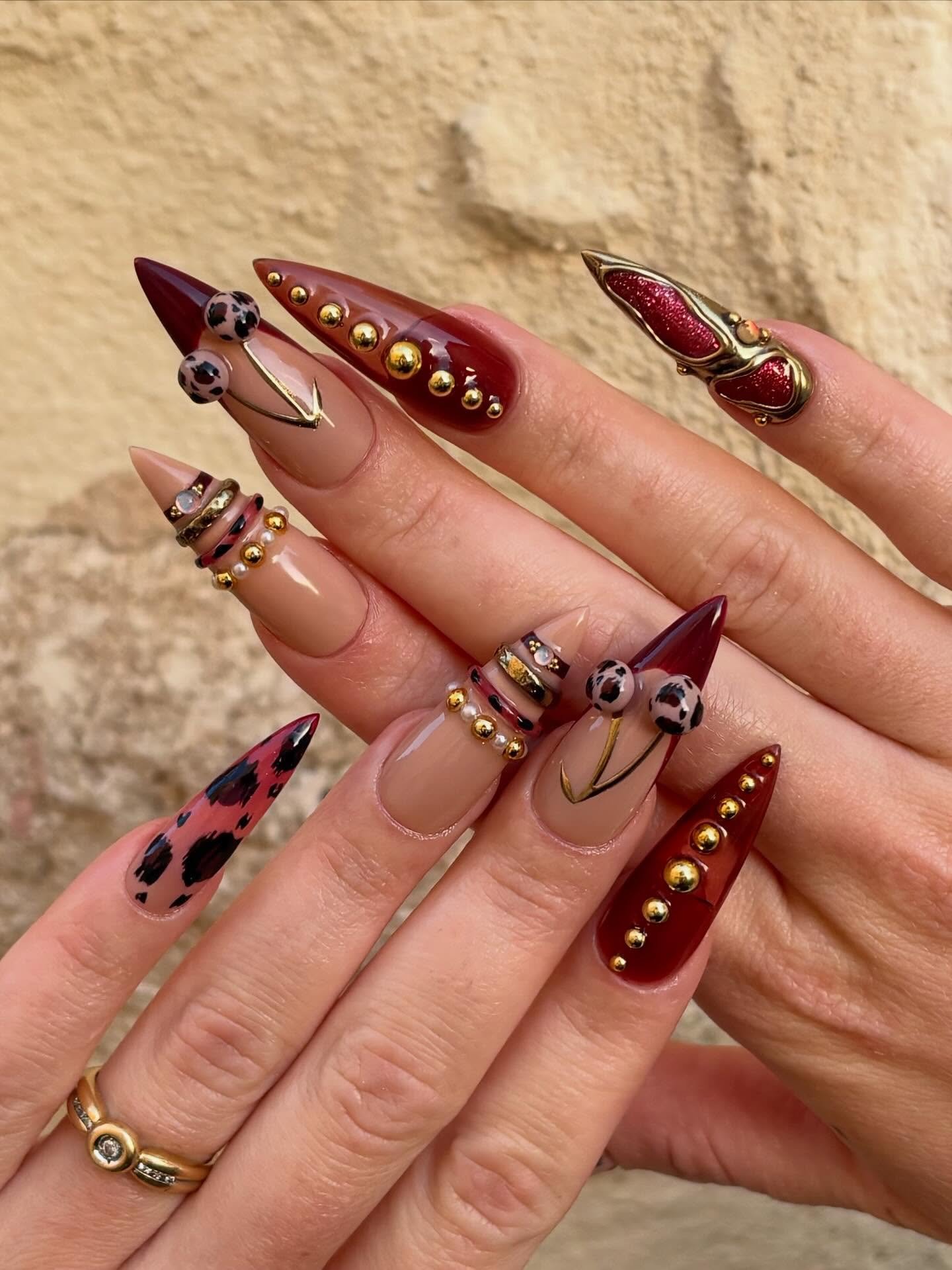Blush Almond Nails with Burgundy Tips and Gold Details