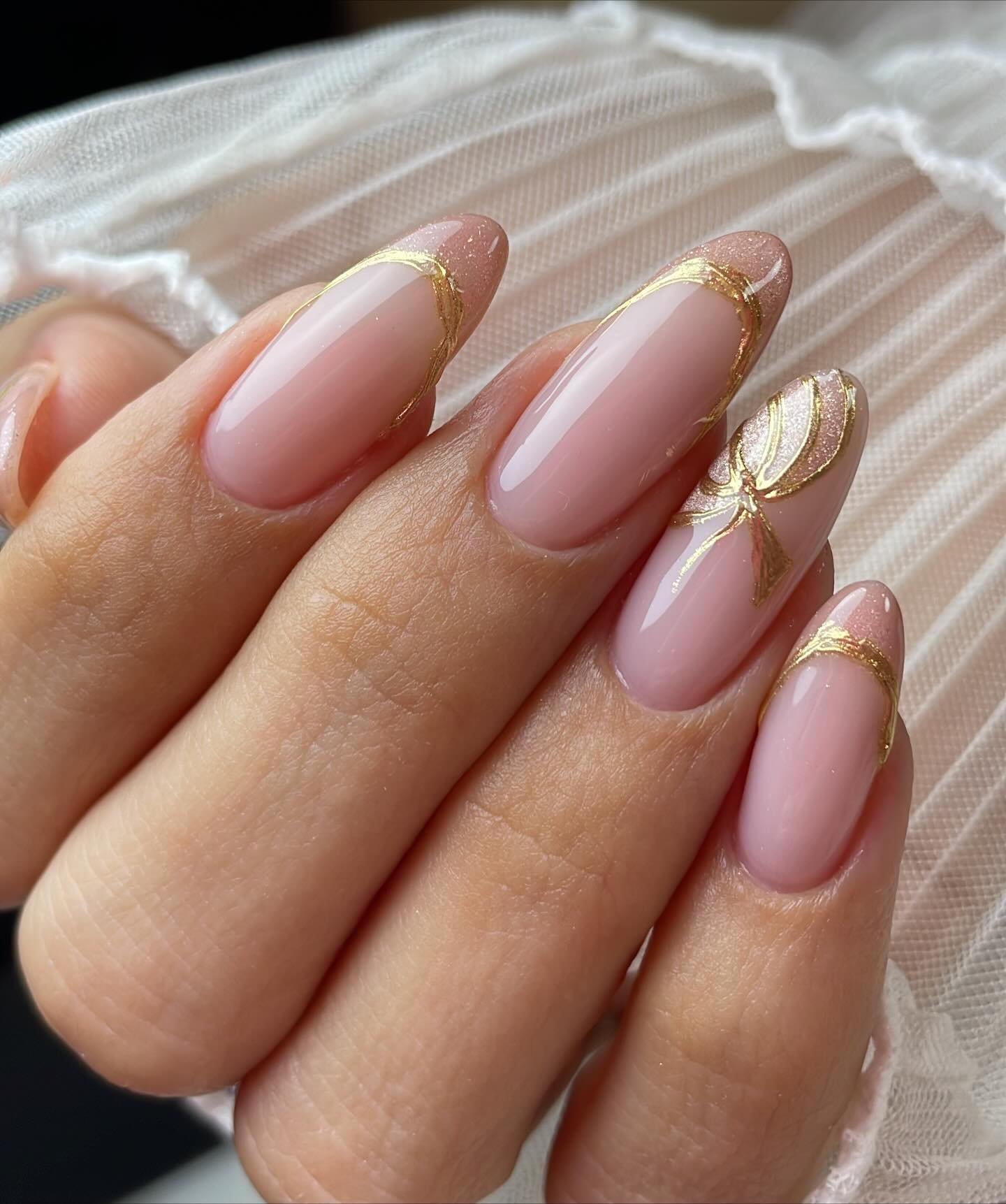 Sheer Pink Almond Nails with Thin Gold Outlines