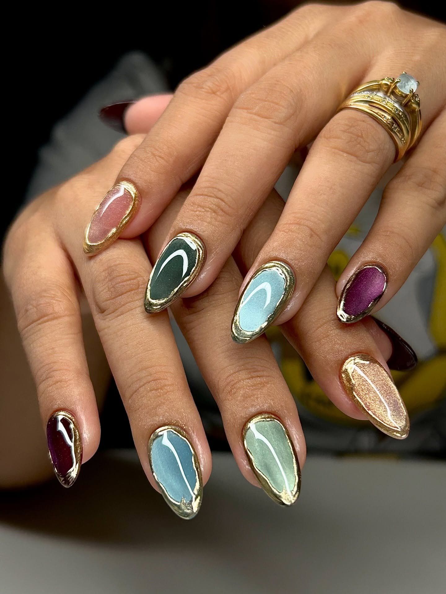 Pastel Almond Nails with Teal, Pink, and Brown Accents