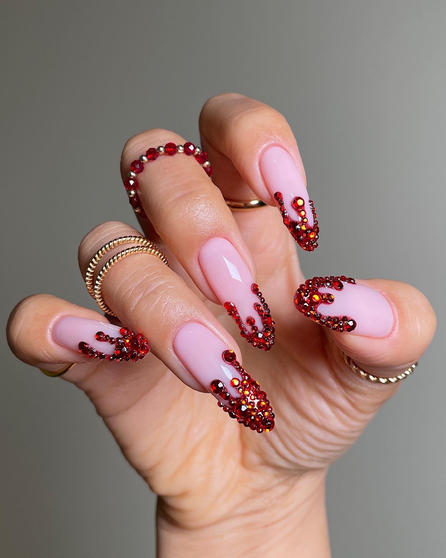 Pink Almond Nails with Red Dots and Fine Burgundy Details