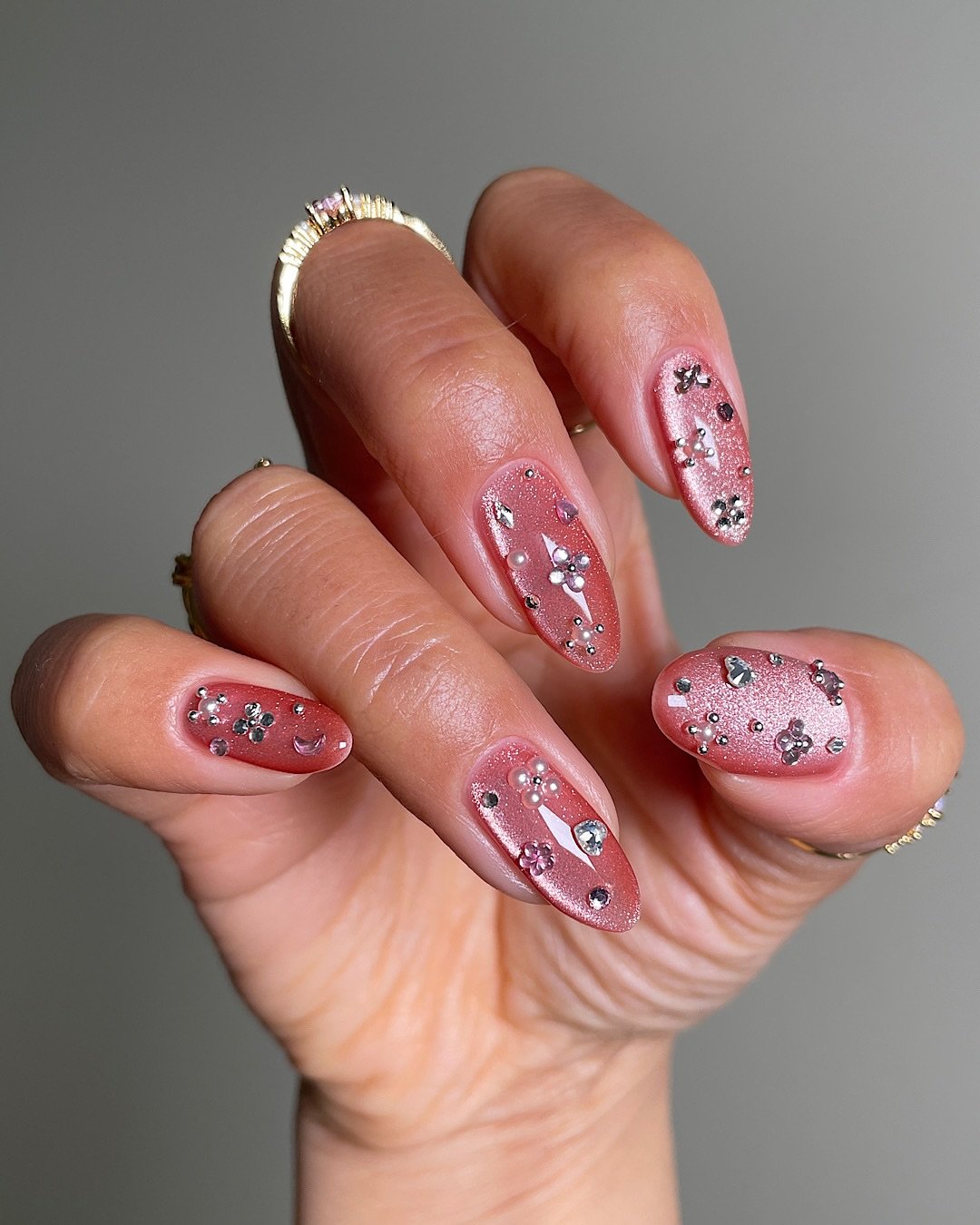 Pink Almond Nails with Red Floral and Glitter Details