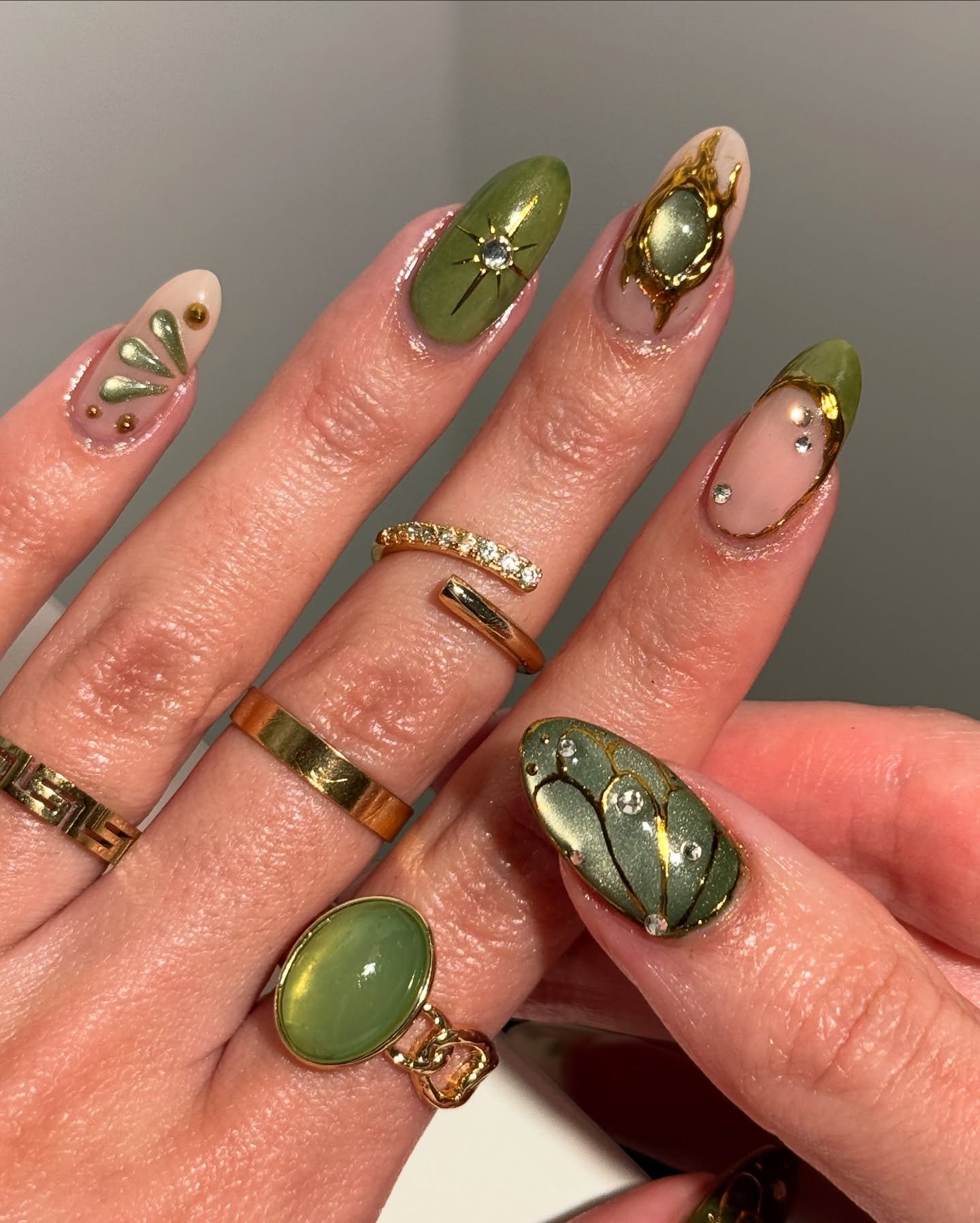 Olive Green Almond Nails with Gold and Brown Details