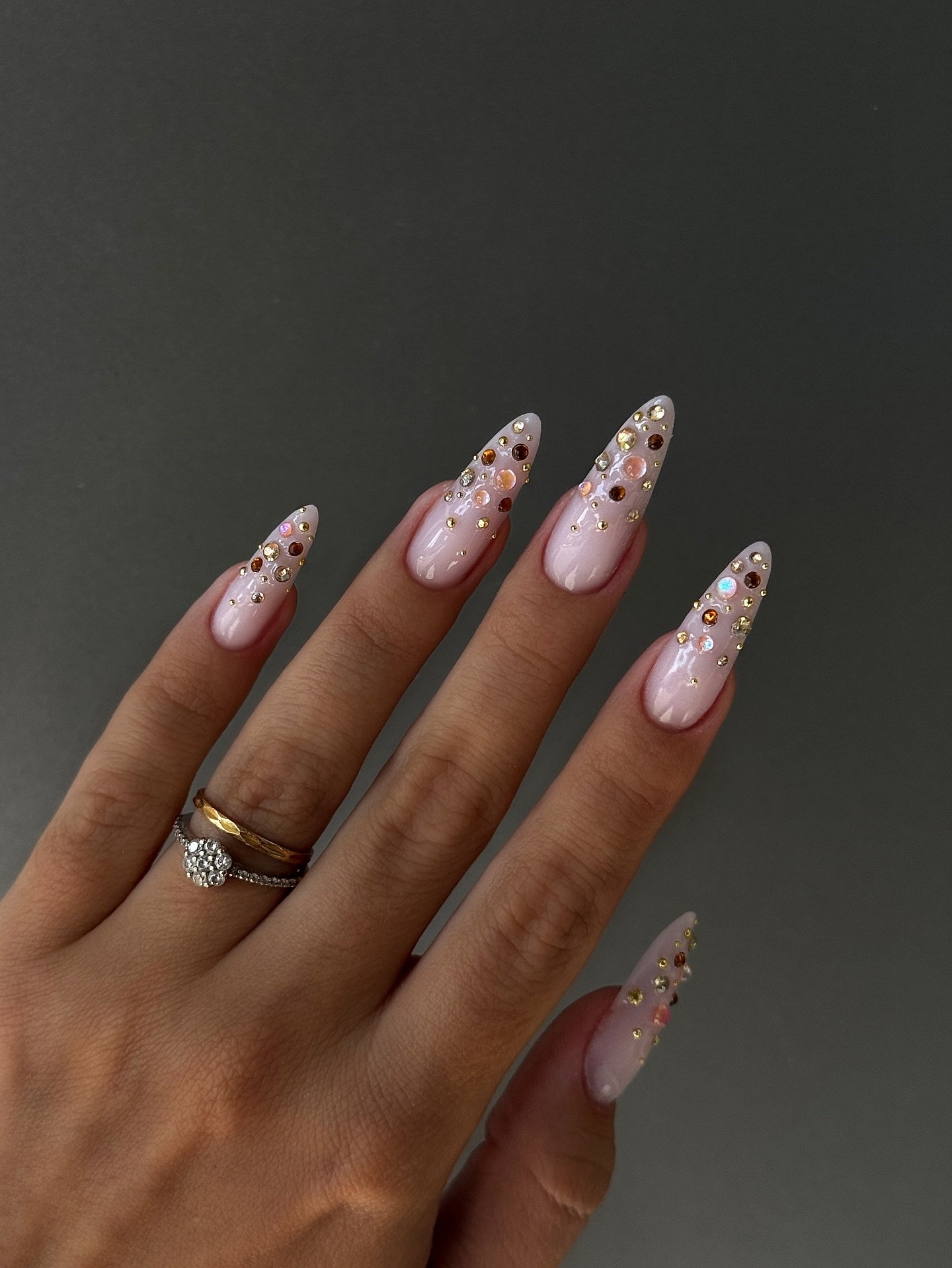 Sheer Nude Almond Nails with Tiny Pink and Silver Details