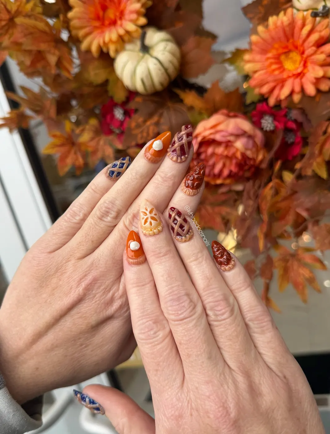 Autumn Floral Nails with Orange and Brown Details