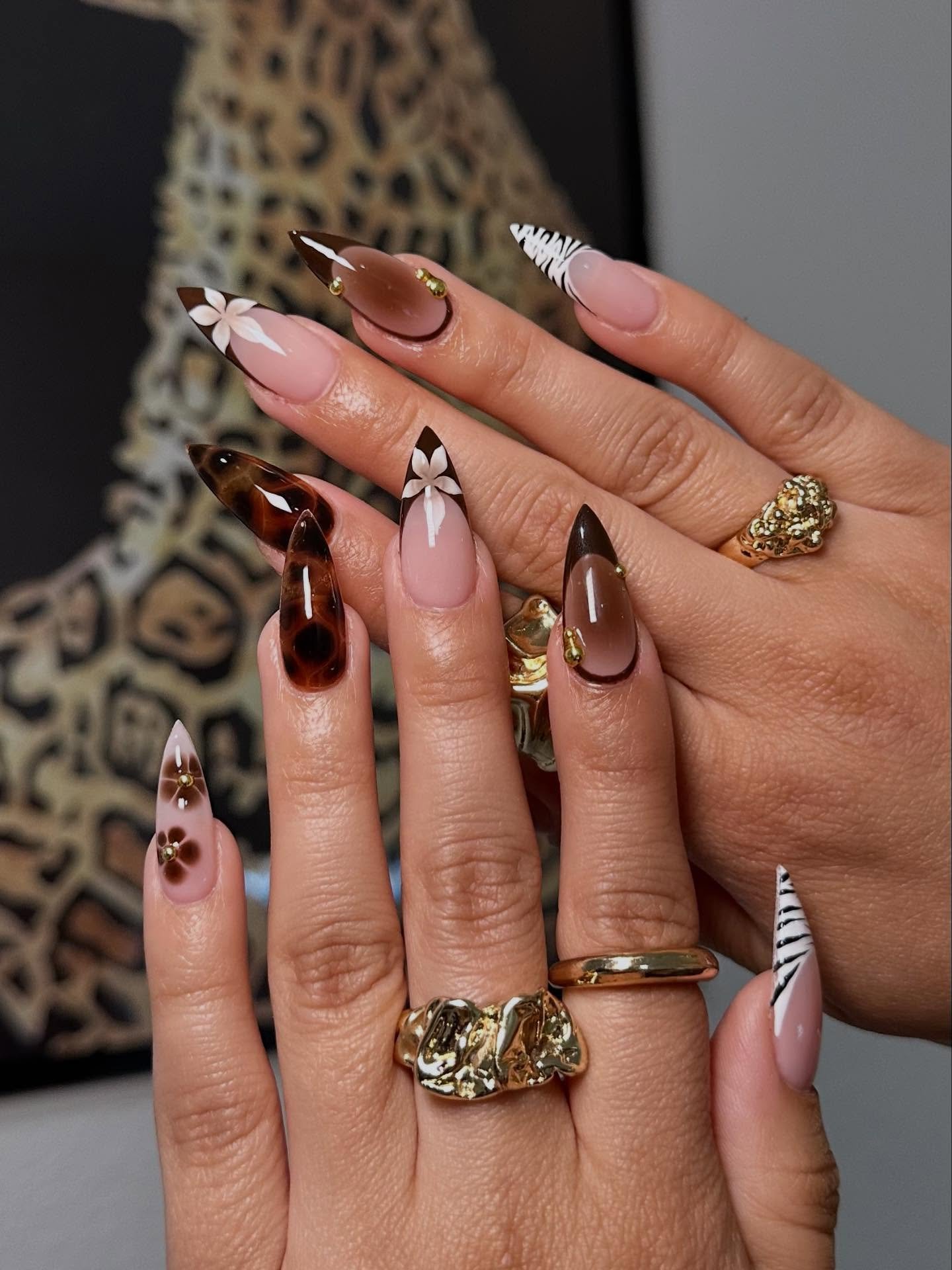Nude Stiletto Nails with Brown and Gold Accents