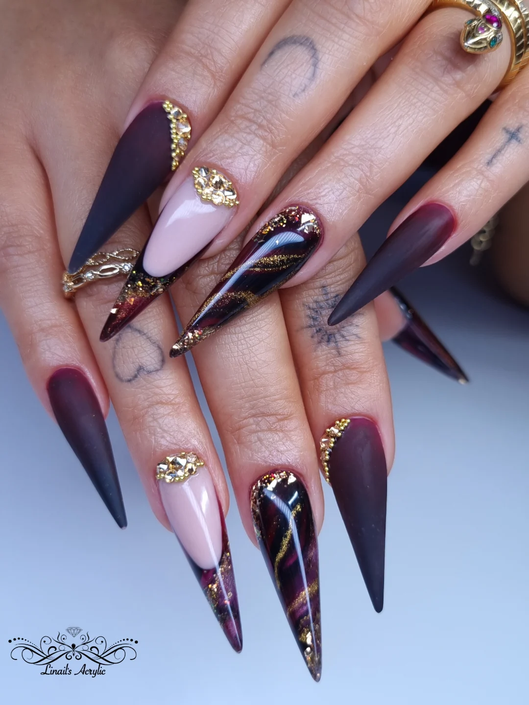 Purple and Black Stiletto Nails with Metallic Accents
