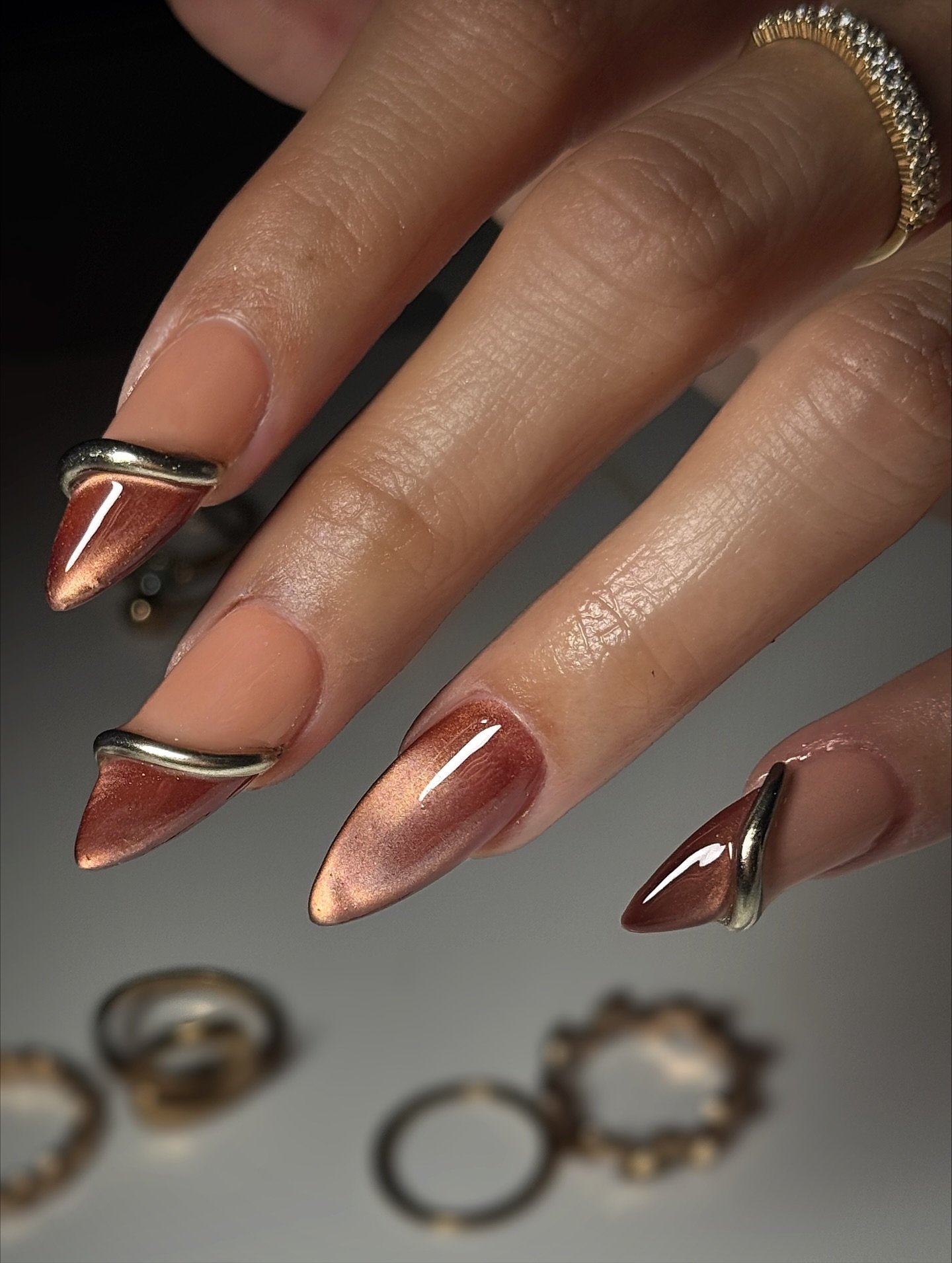 Nude and Brown Stiletto Nails with Copper-Toned Tips