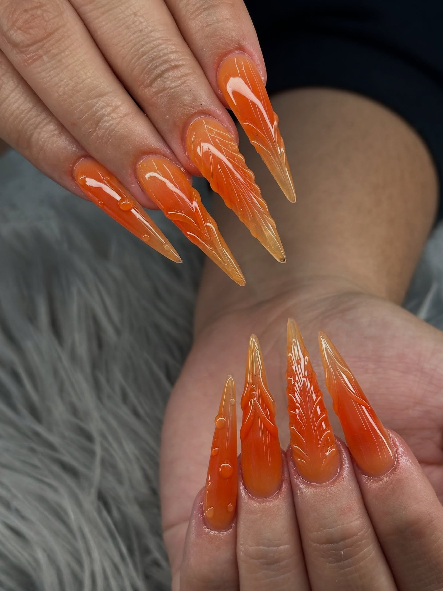 Bright Orange Stiletto Nails with Clear Line Accents