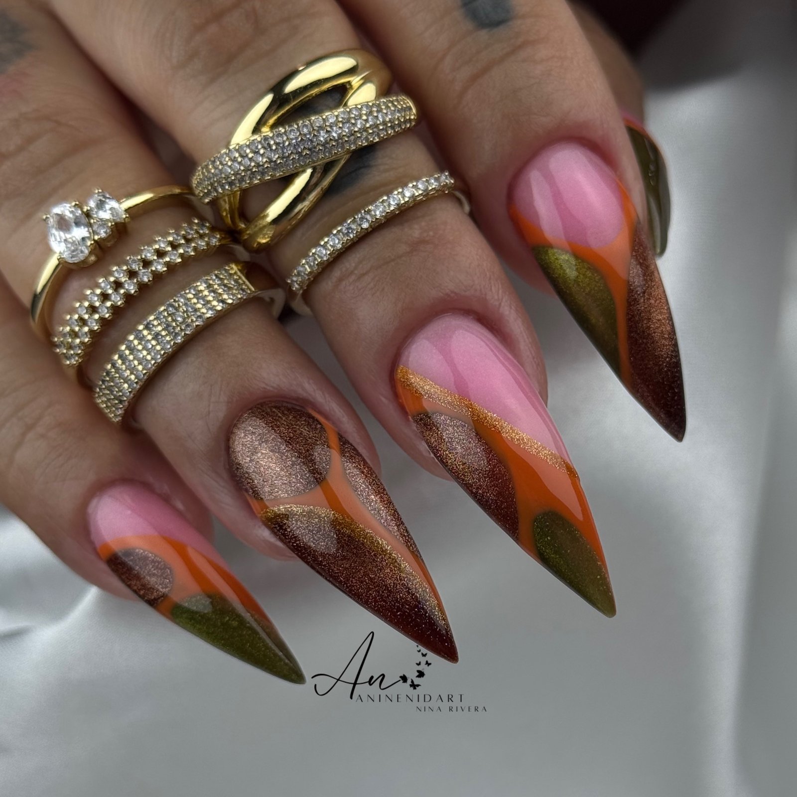 Pink and Brown Stiletto Nails with Green and Orange Accents
