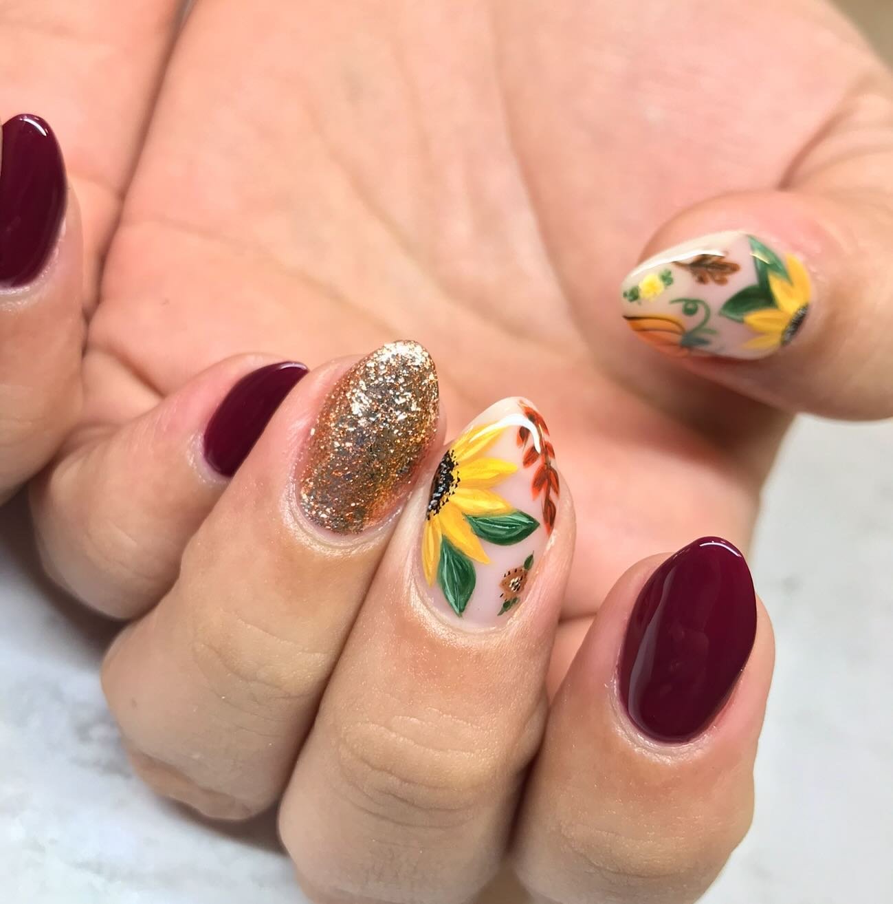Sheer Neutral Nails with Burgundy and Gold Details