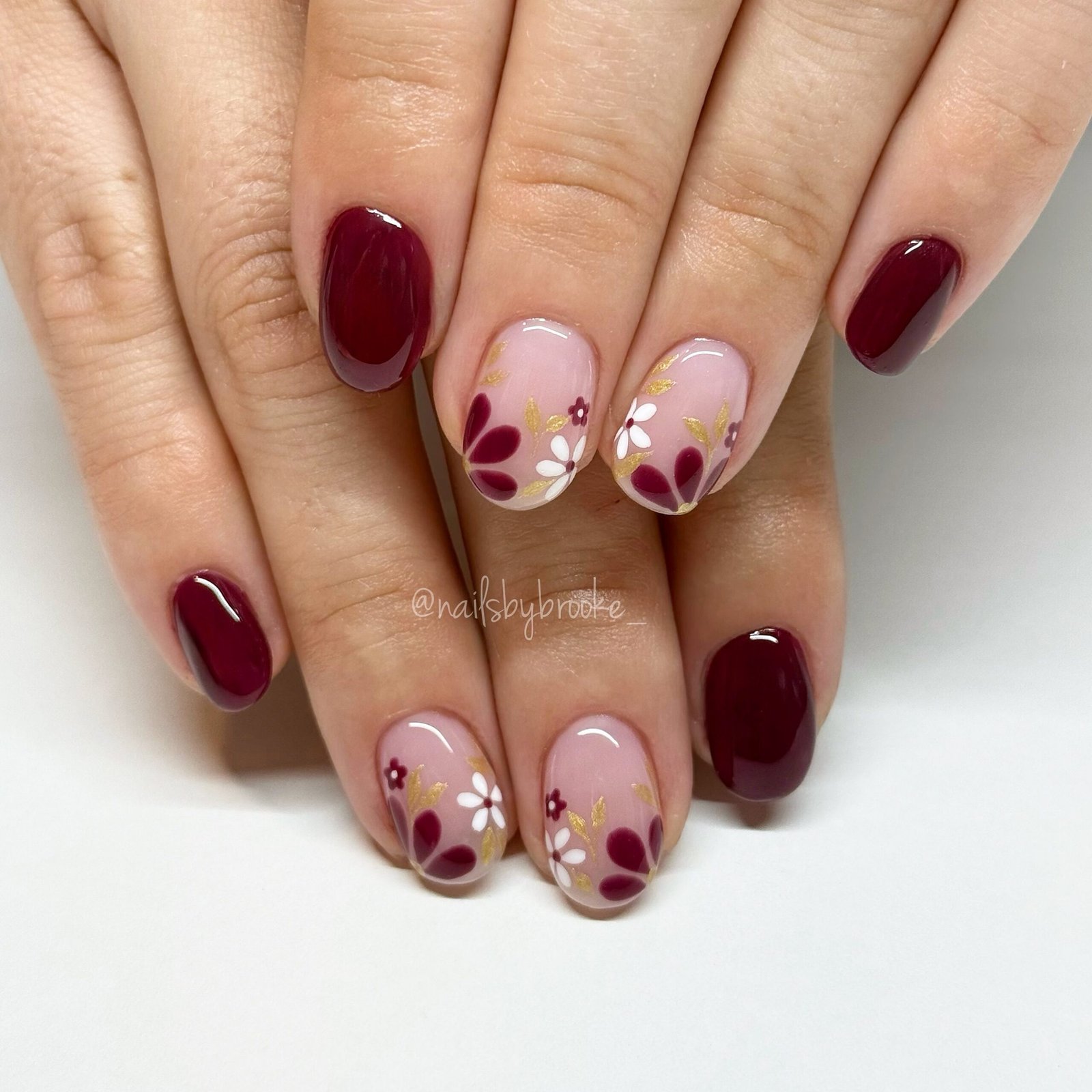 Short Burgundy Nails with Nude Floral Accent Nails