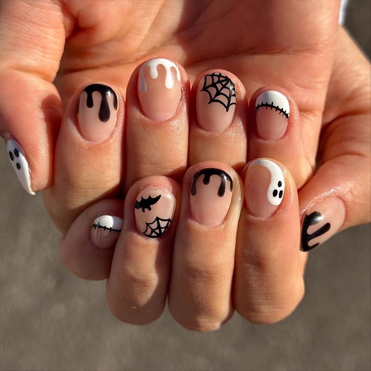 Nude and Black Halloween Nails with Stitched Details — DPzhUjKkePQBRYNLEE UT NAIL TECH.jpg