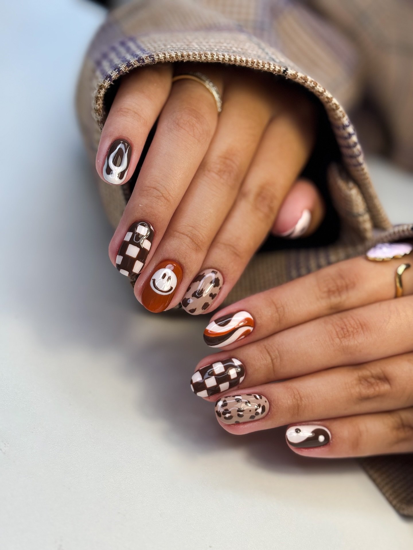 Brown Checkerboard and Swirl Accent Nails