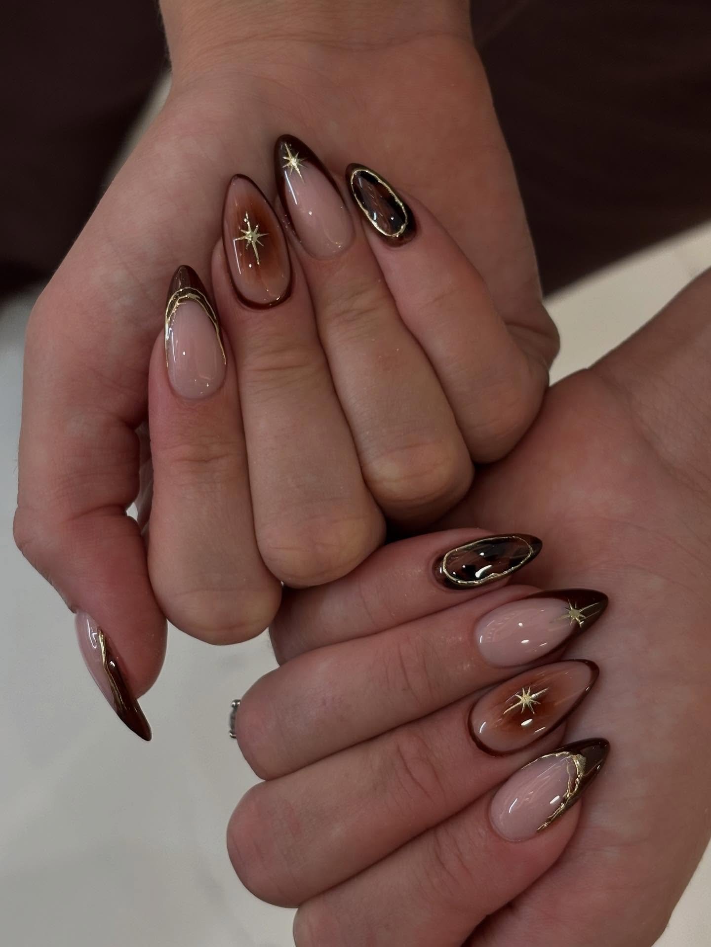 Sheer Nude Nails with Brown Outlines and Gold Stars