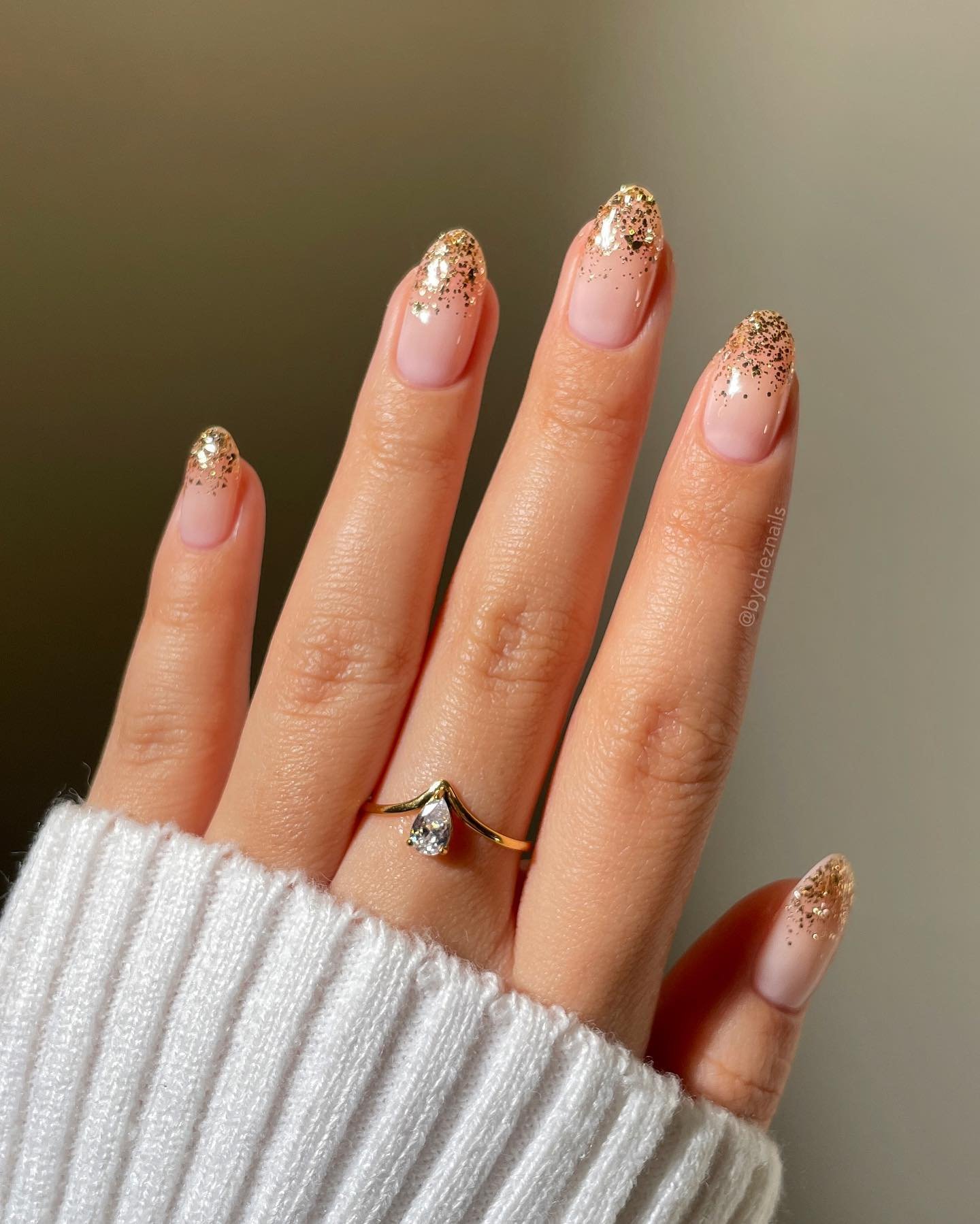 Nude Almond Nails with Gold Glitter French Tips