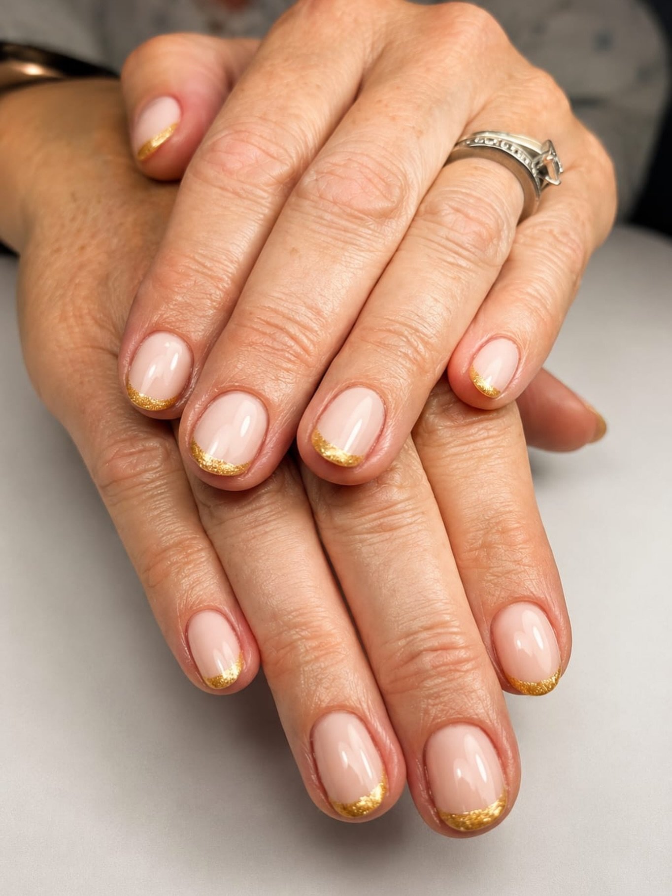 Sheer Nude Nails with Delicate Gold Glitter Edges