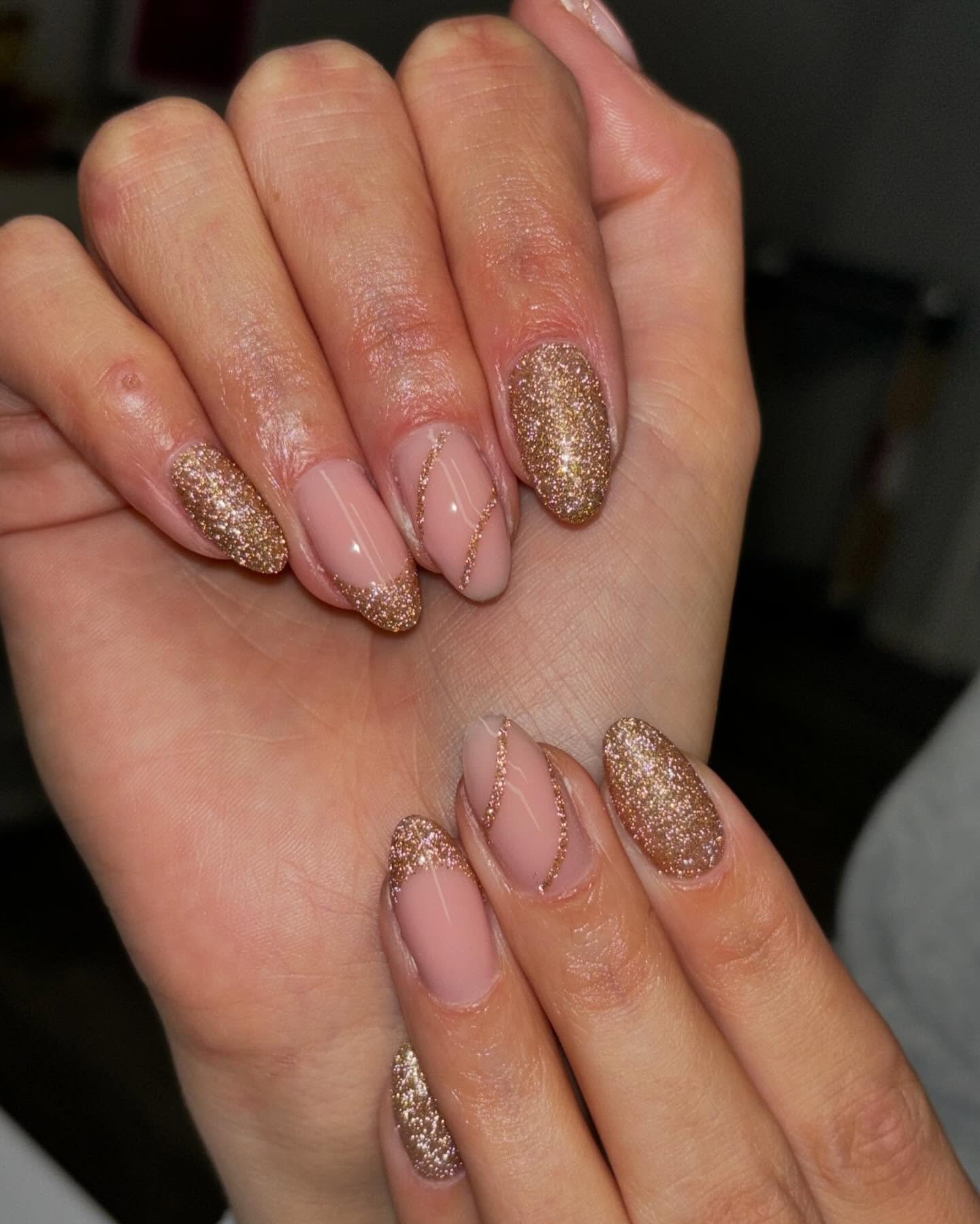 Nude Almond Nails with Gold Glitter and Fine Line Details