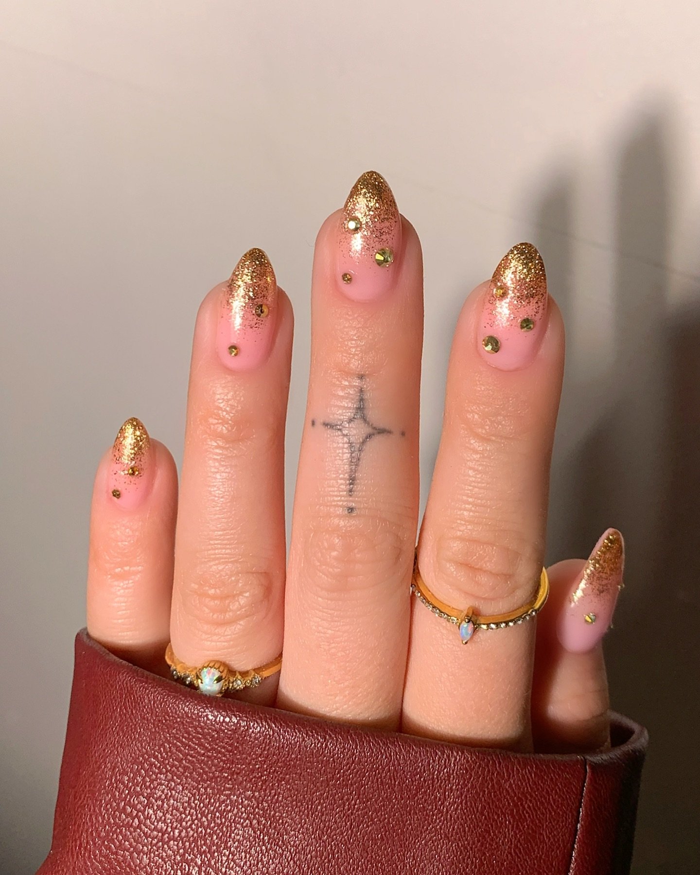Pink Almond Nails with Gold Glitter Tips and Tiny Studs
