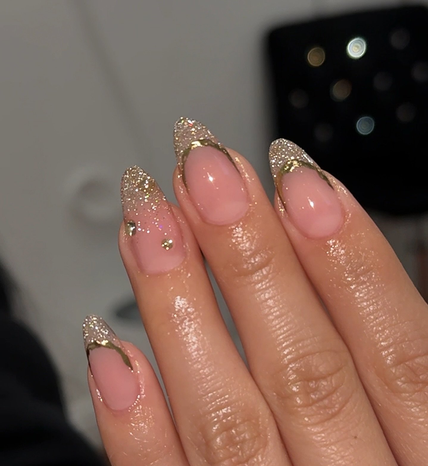 Sheer Pink Almond Nails with Gold Glitter French Tips