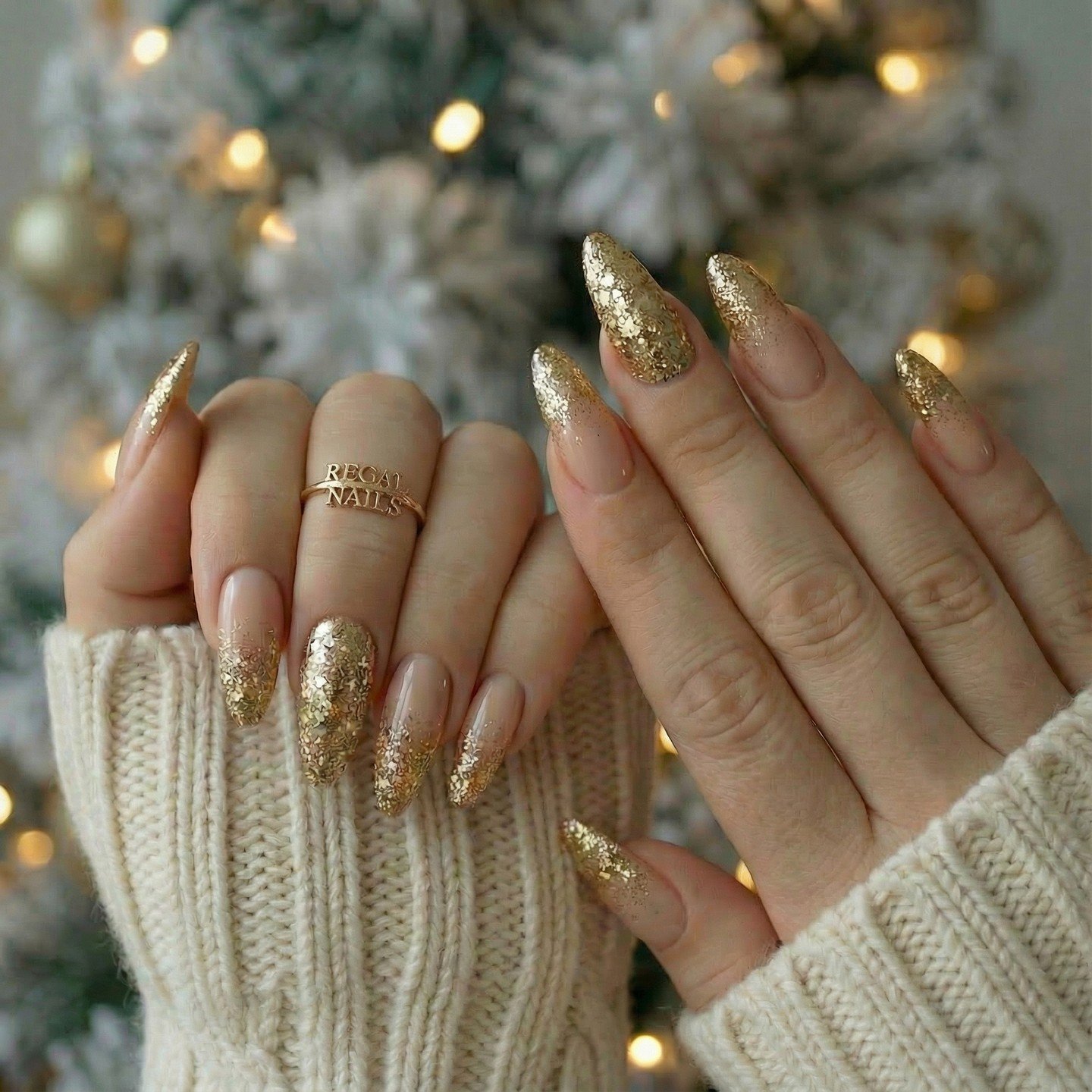 Gold Glitter Almond Nails in a Holiday Setting
