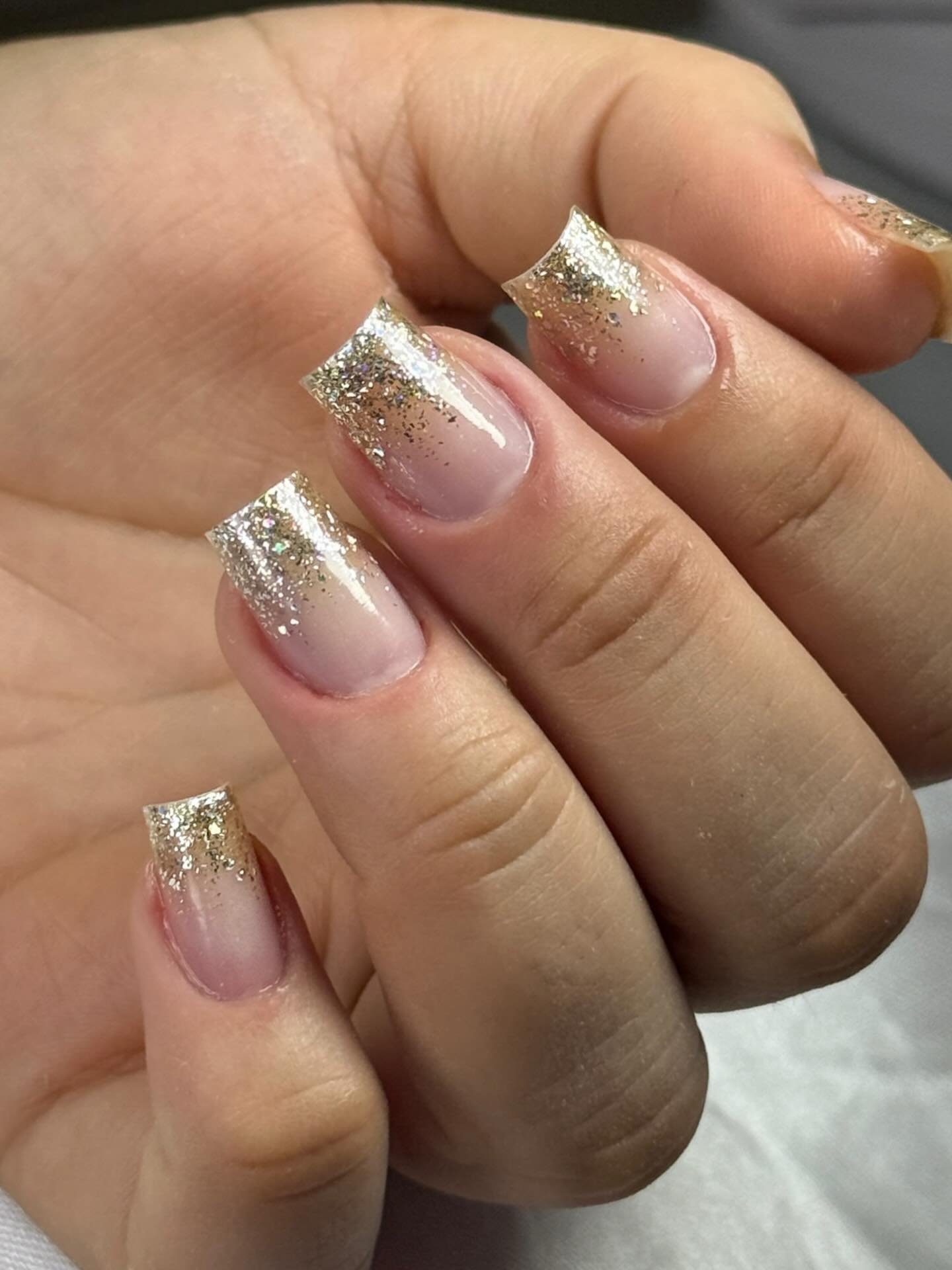 Sheer Nude Nails with Silver-Gold Glitter French Tips