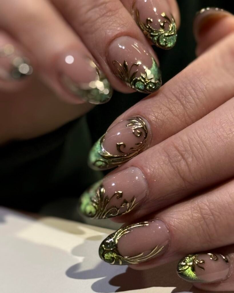 Green Nails with White Floral Accents and Gold Details