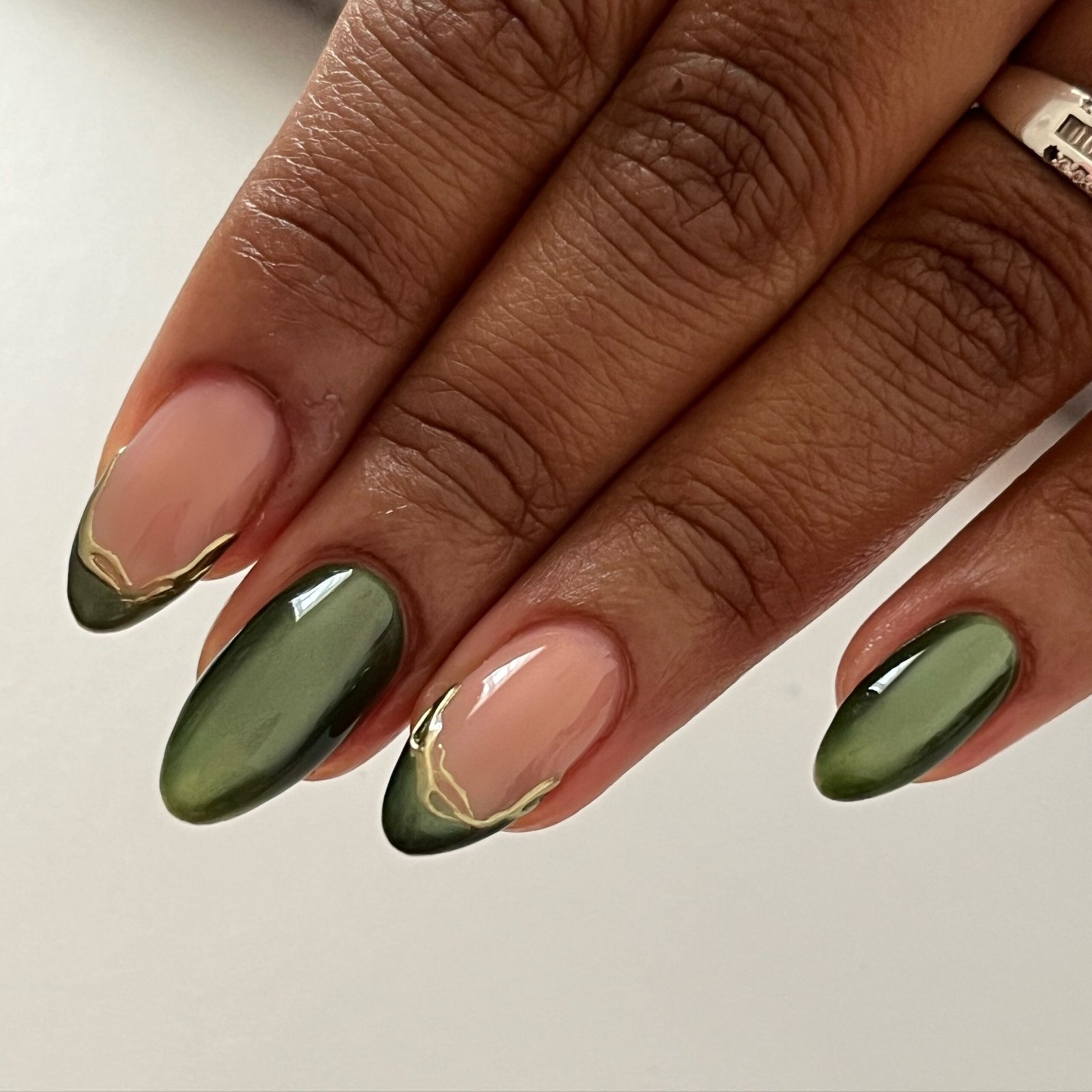 Jewel Green Almond Nails with Gold Foil Details