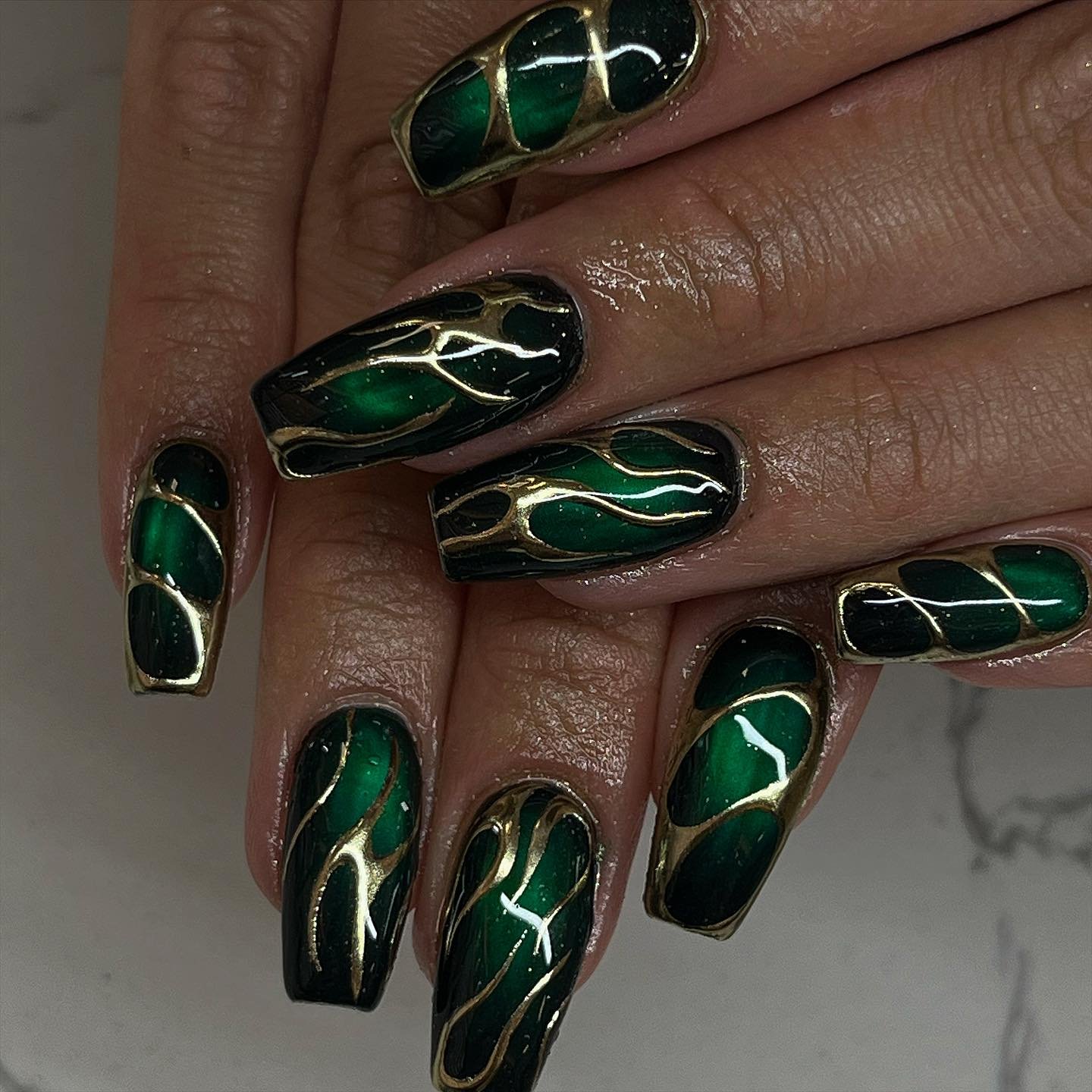Nude Nails with Ornate Gold and Green Accents