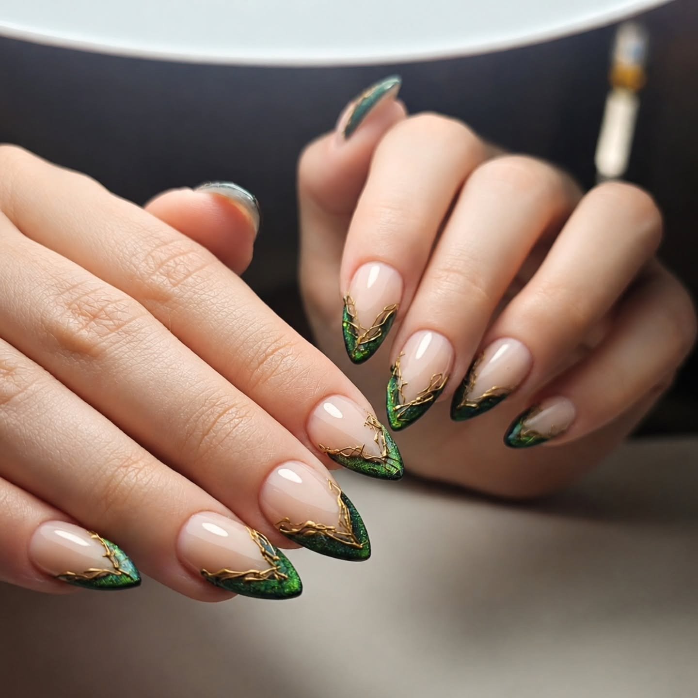 Nude Almond Nails with Green-and-Gold French Tips