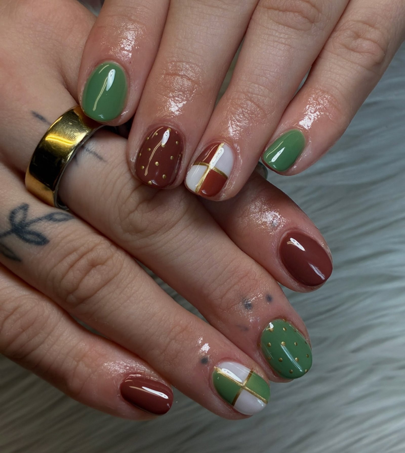 brown and green glossy accent nails