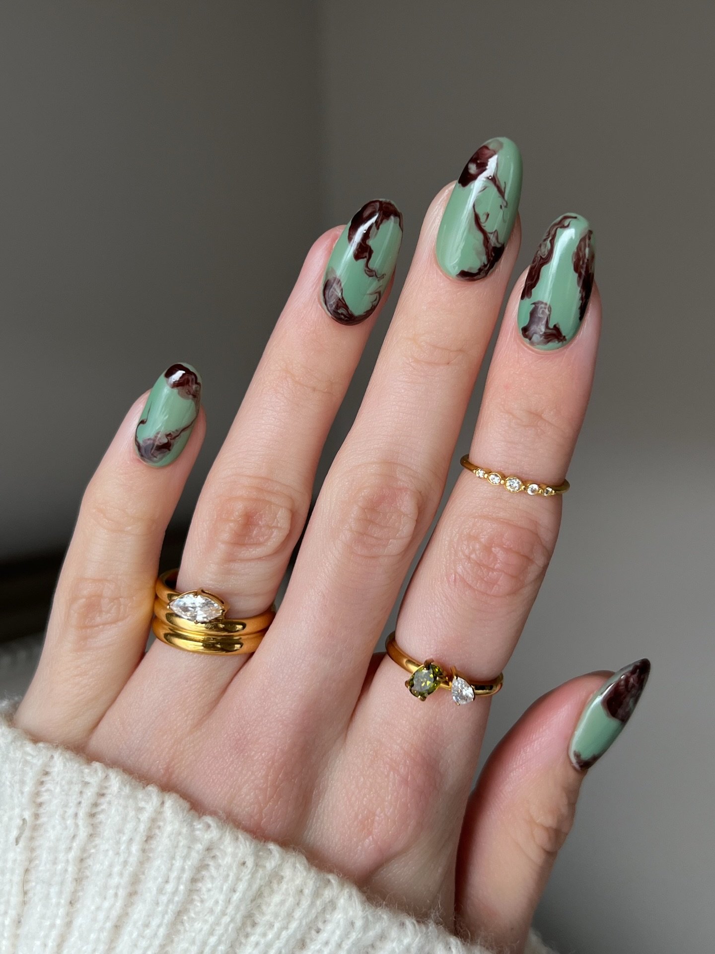 green nails with brown and black leaf like details