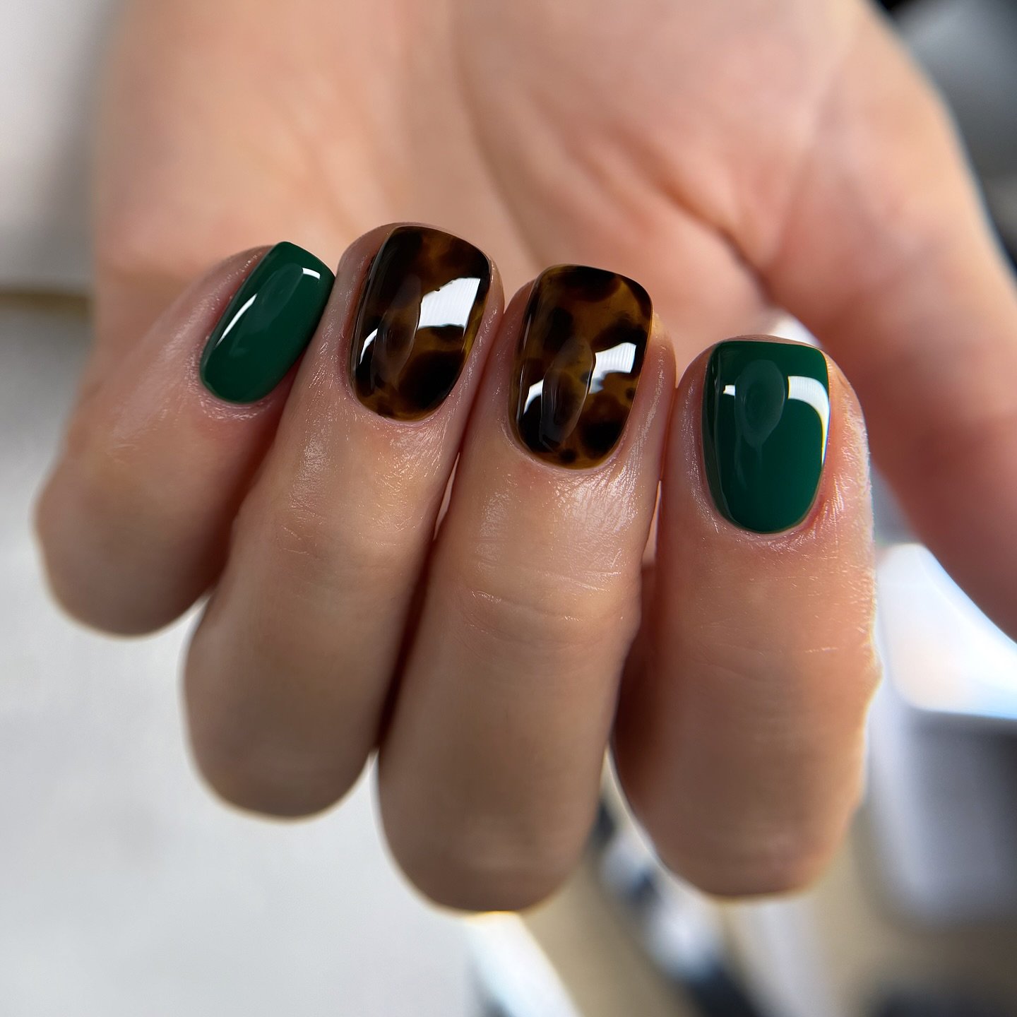 deep green and chocolate brown glossy nails