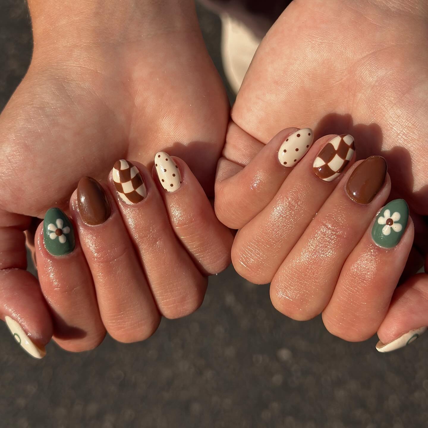 brown nails with green and white accent details