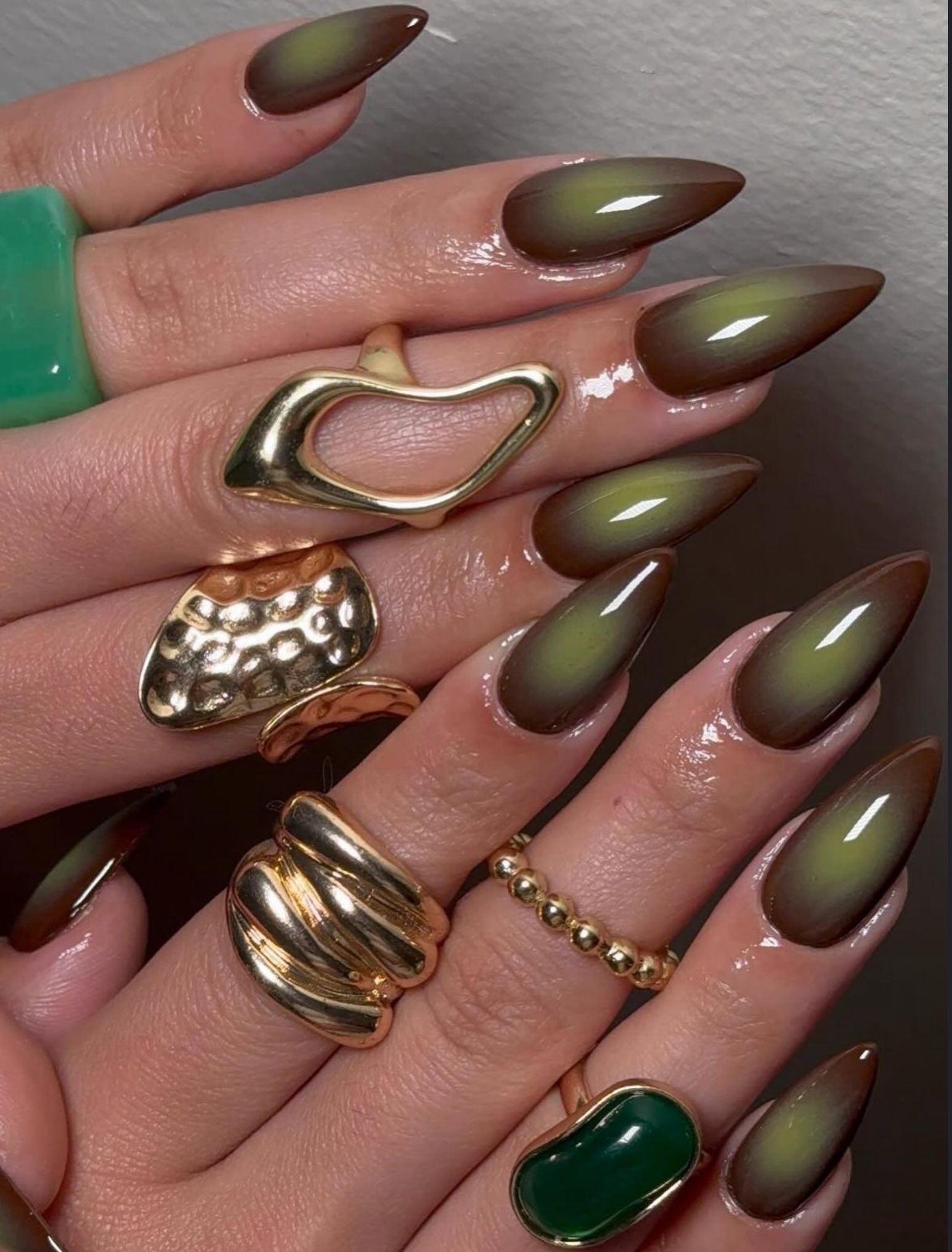 olive green nails with metallic gold details