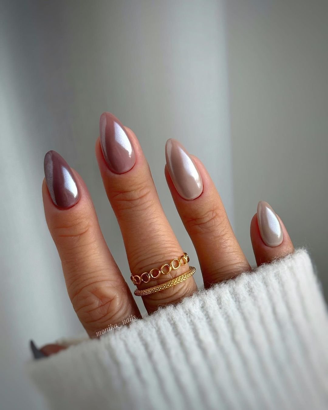 ornate silver and gold swirl almond nails