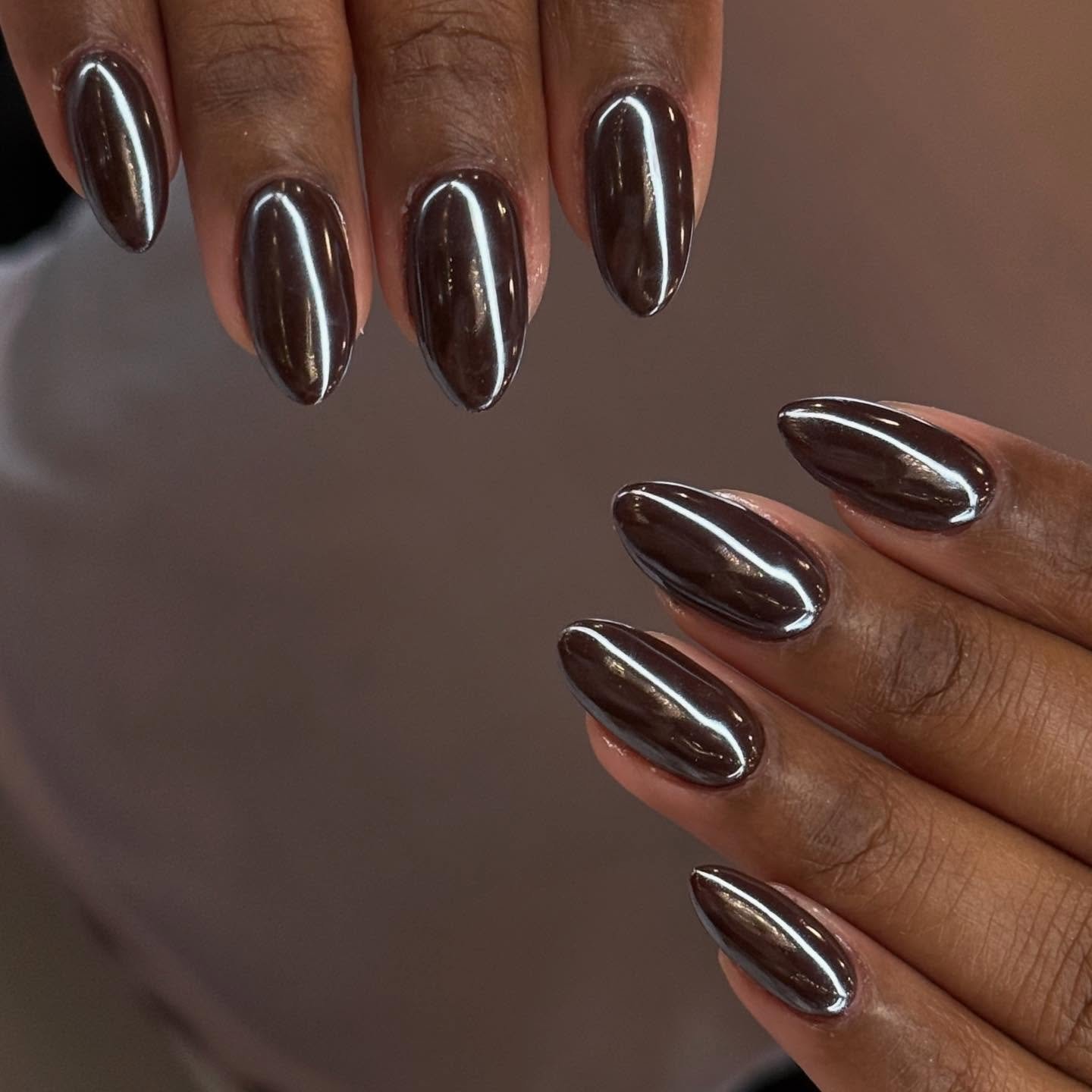 deep brown chrome almond nails
