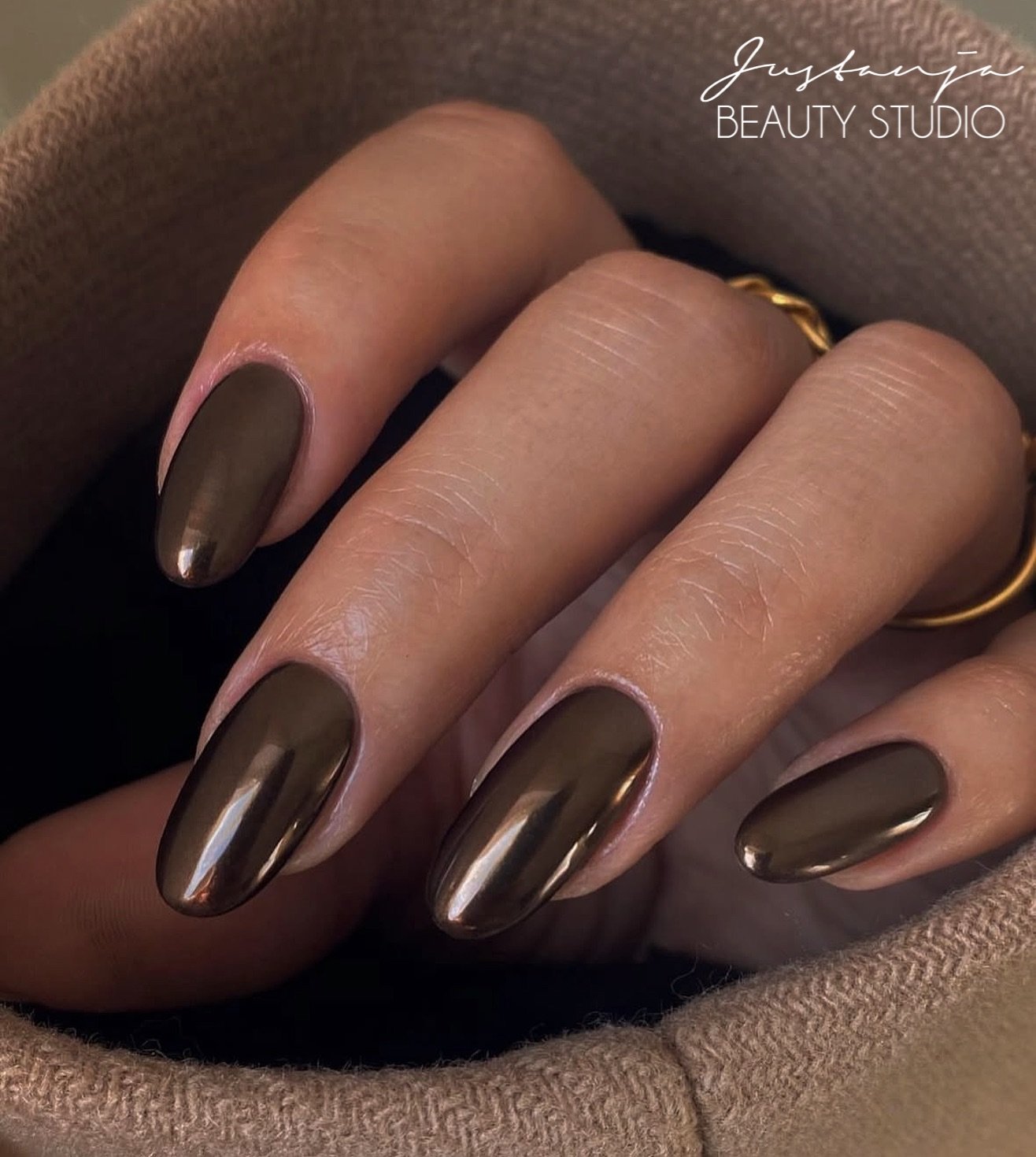 deep brown chrome almond nails