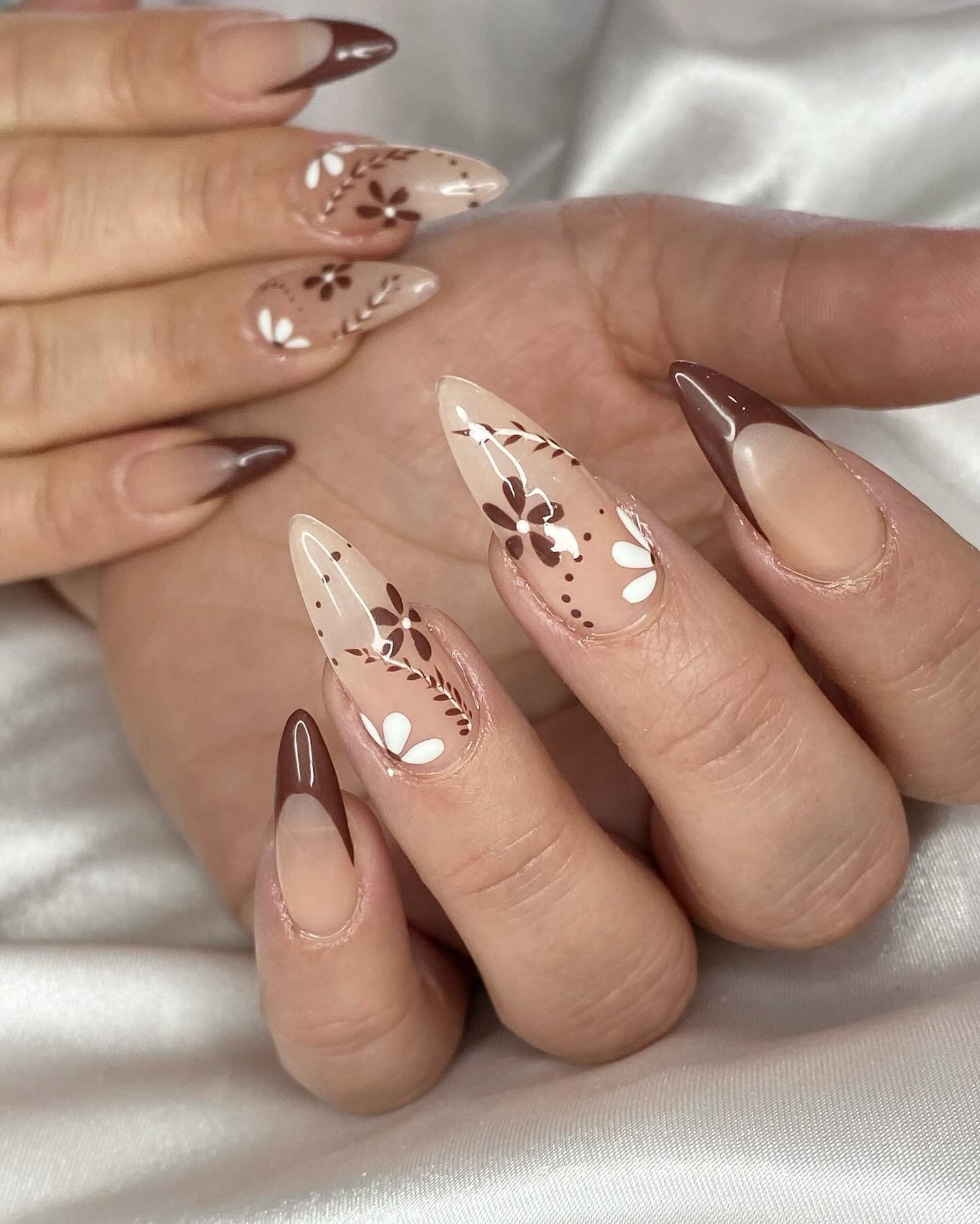 Nude Almond Nails with Brown French Tips and Delicate Art