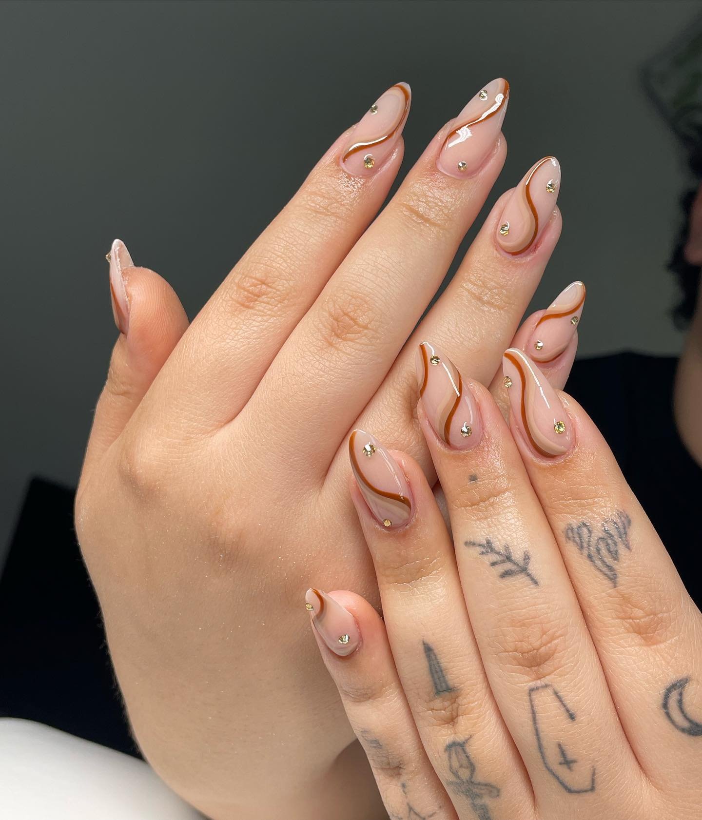 Blush Almond Nails with Fine Curved Line Details