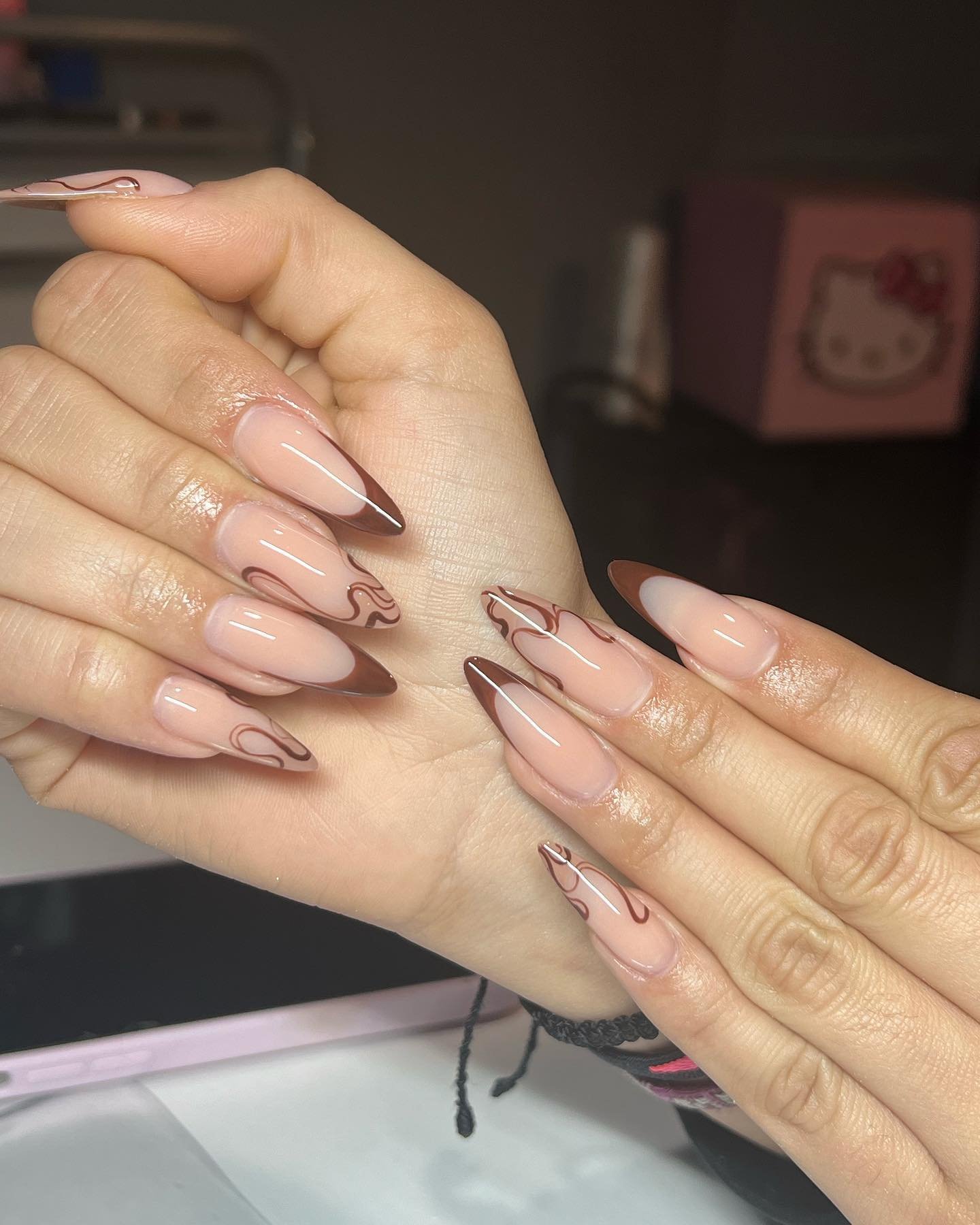 Long Nude Almond Nails with Fine Brown Swirls