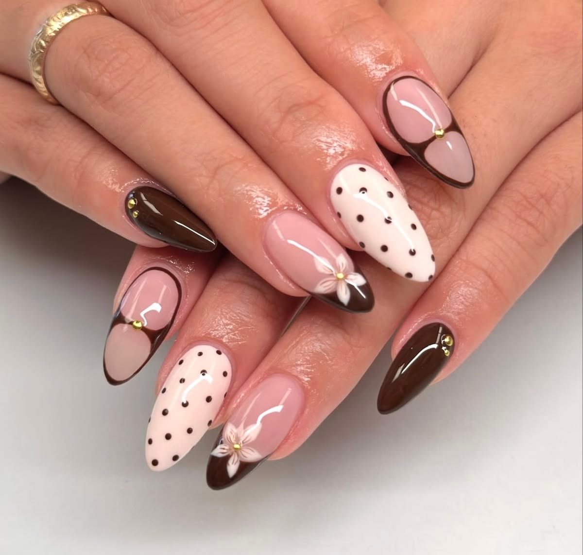 Pink Almond Nails with Brown Tips, Dots, and Floral Accents