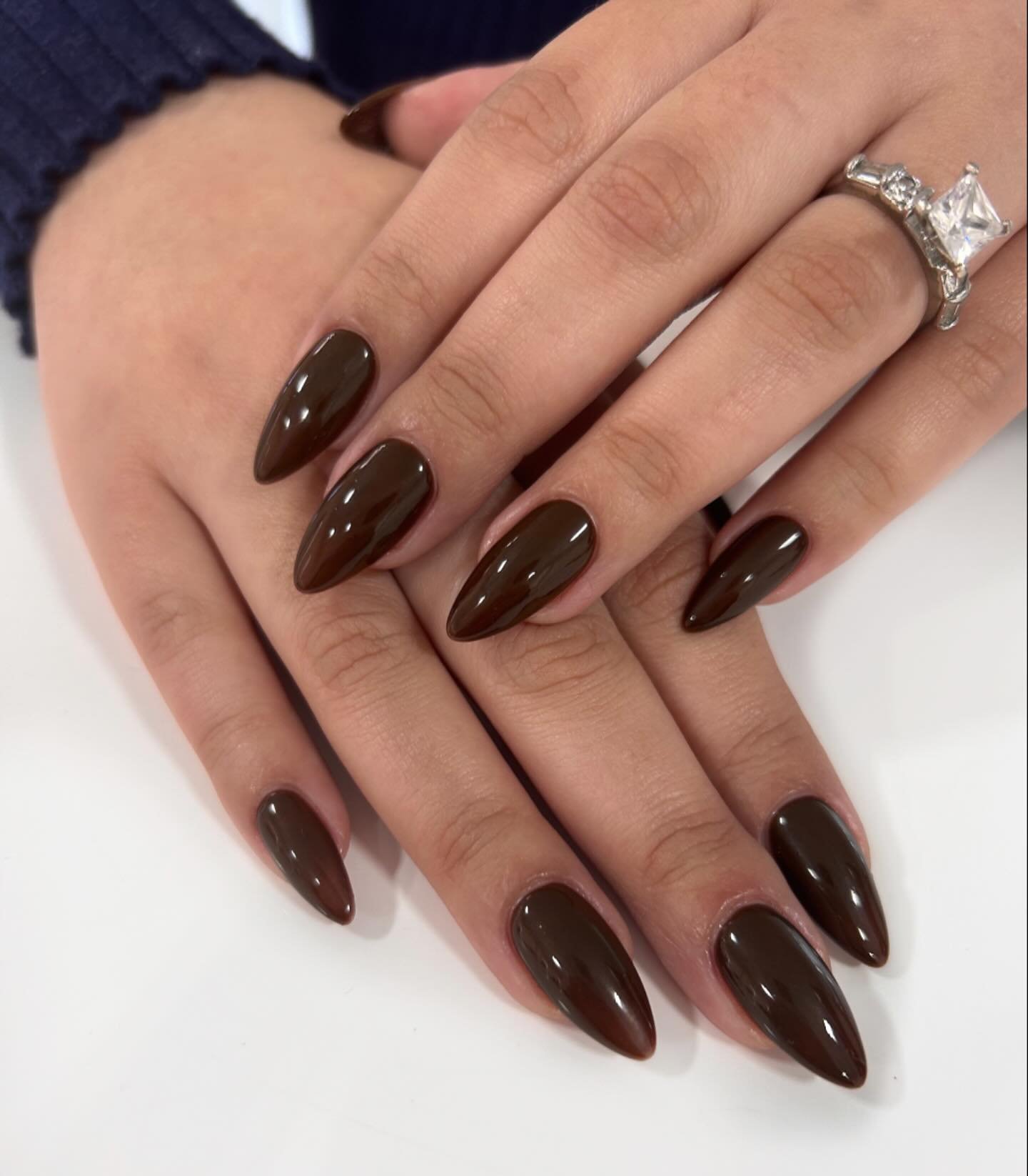 Glossy Deep Brown Almond Nails